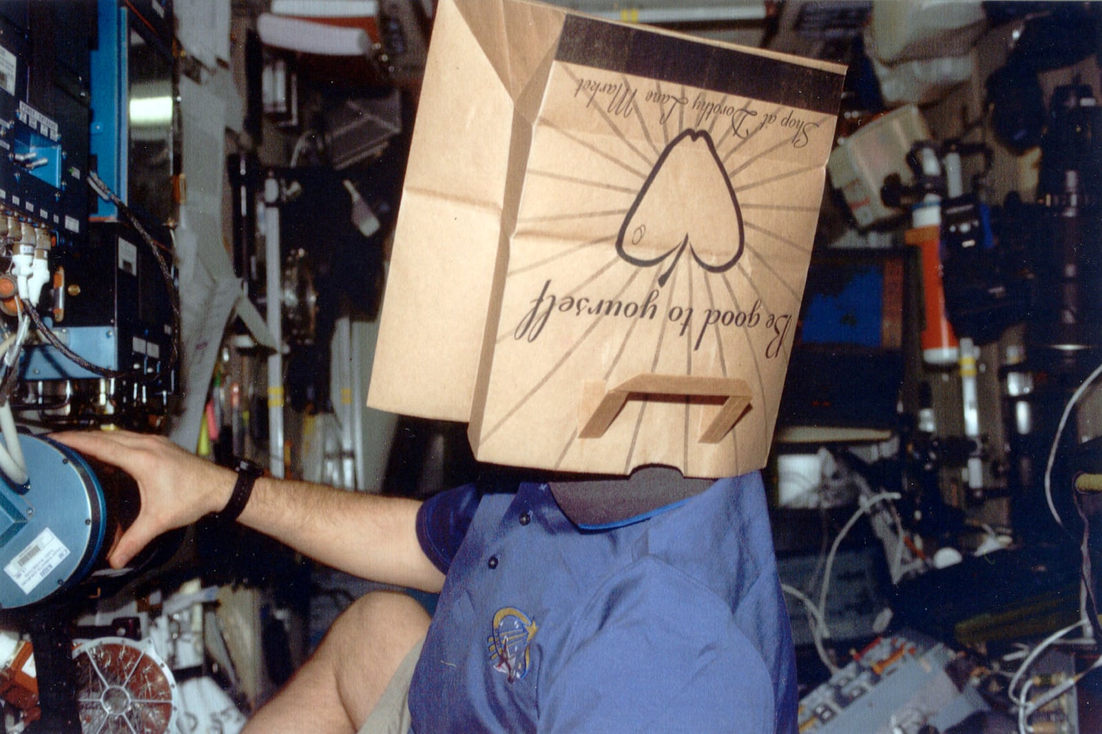 Air Force Col. Gregory Johnson, astronaut from Fairborn who recently piloted the space shuttle wearing a Dorothy Lane Market bag on his head