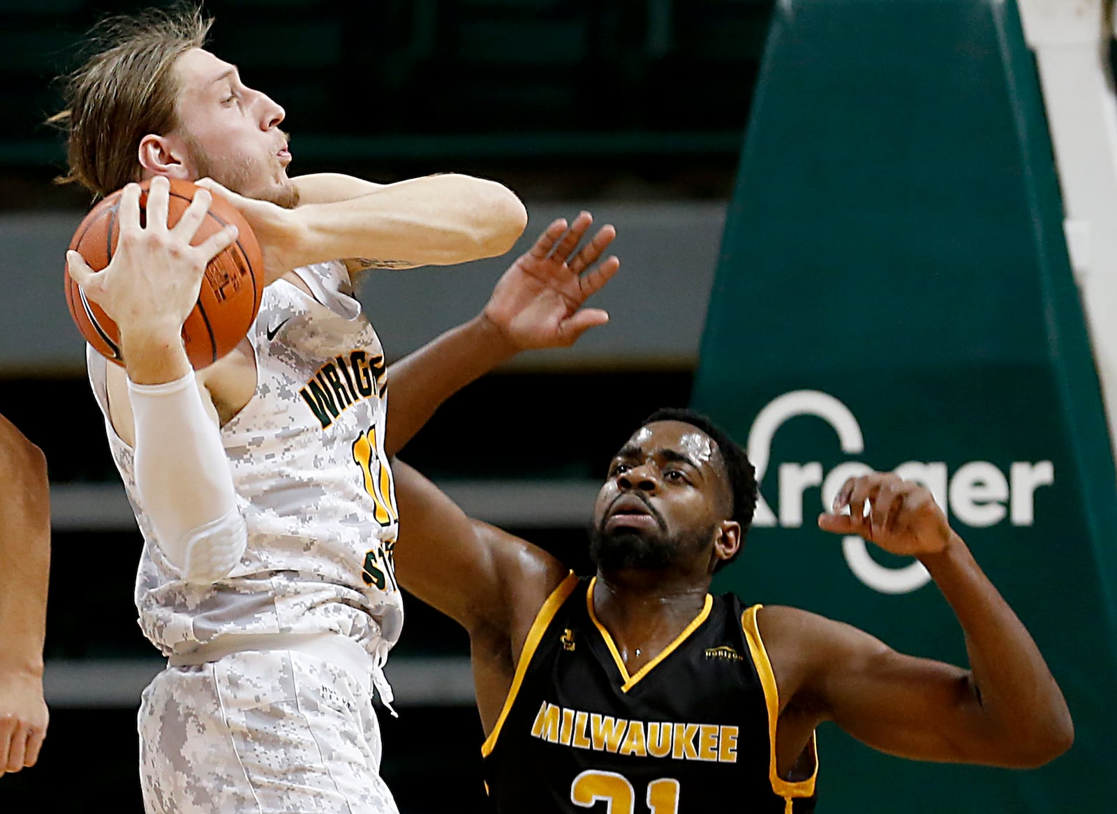 Wright State center Loudon Love grabs a defensive rebound against Milwaukee forward Tafari Simms during a Horizon League quarterfinal at the Nutter Center in Fairborn Mar. 2, 2021. Wright State lost 94-92. E.L. Hubbard/CONTRIBUTED