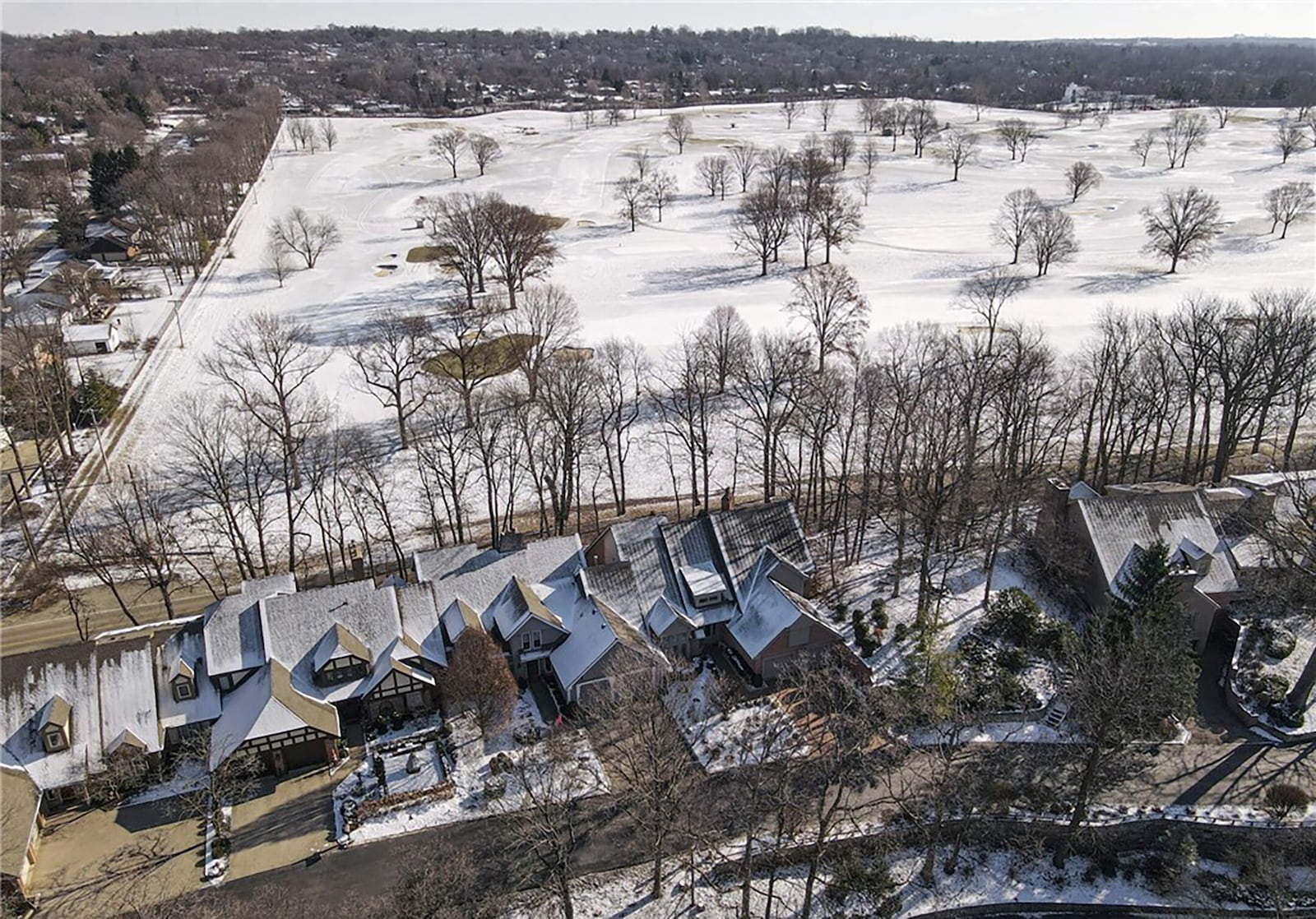 The home overlooks the NCR Golf Course and has a tree line behind for privacy.