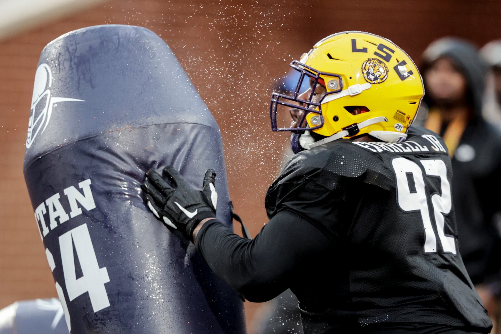 American Team defensive lineman Neil Farrell Jr., from LSU, runs through drills during practice for the Senior Bowl college football game, Wednesday, Feb. 2, 2022, in Mobile, Ala. (AP Photo/Butch Dill)