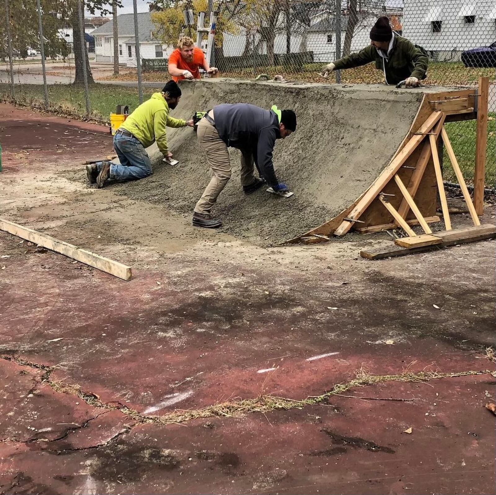 David Schweitzer (center) the project manager for the DIY skate park at Claridge Park, working with a team of volunteers to build an obstacle. This and the DIY park on Home Avenue are in development with assistance from The Collaboratory in Dayton and Rhymesayers Entertainment in Minneapolis.