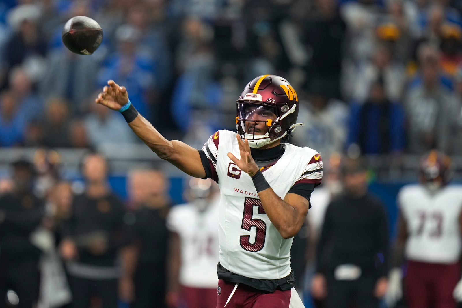 Washington Commanders quarterback Jayden Daniels (5) throws against the Detroit Lions during the first half of an NFL football divisional playoff game, Saturday, Jan. 18, 2025, in Detroit. (AP Photo/Seth Wenig)