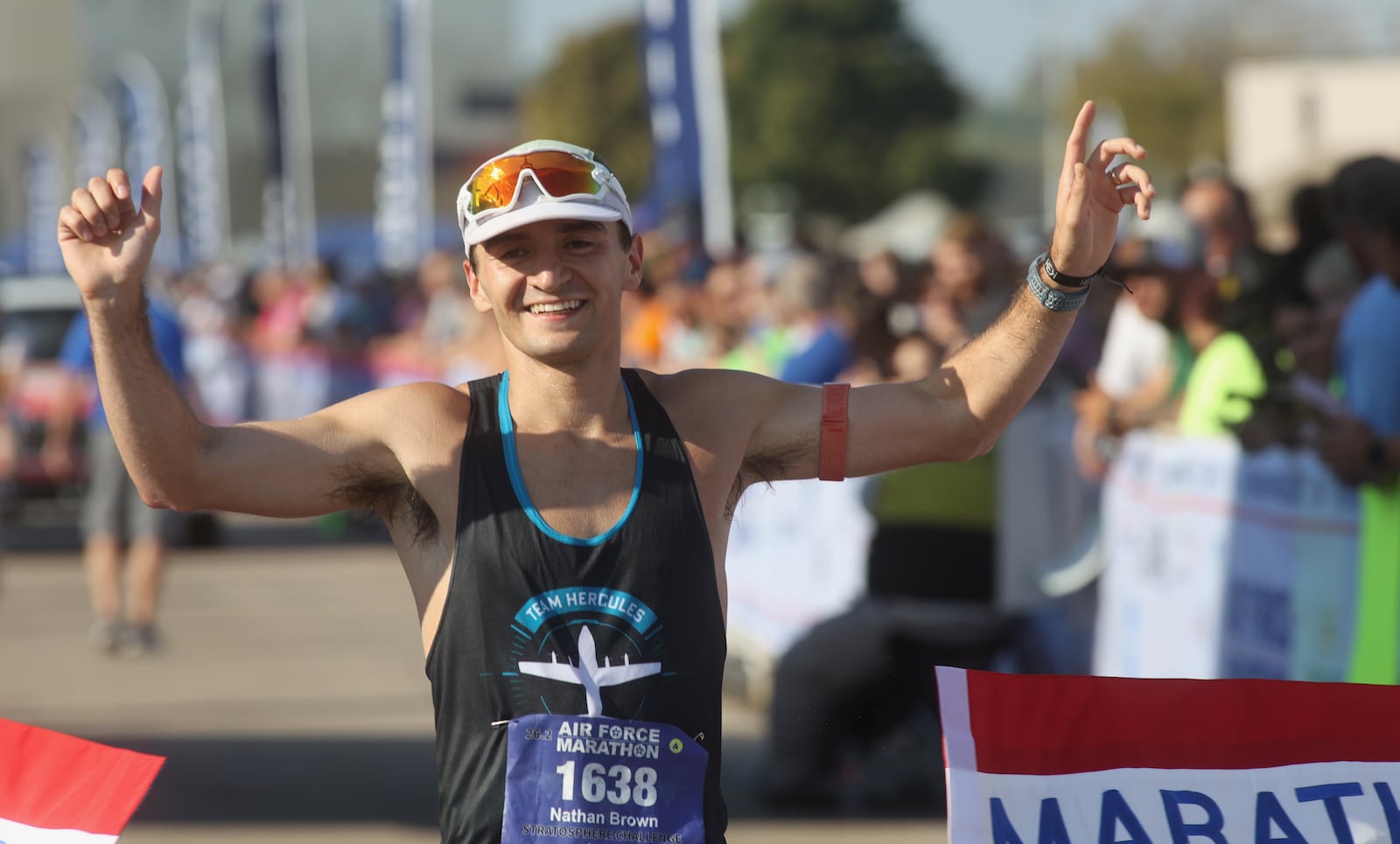 Nathan Brown, of San Diego, crosses the finish line as the first male finisher at the Air Force Marathon on Saturday, Sept. 21, 2024, at Wright-Patterson Air Force Base. David Jablonski/Staff