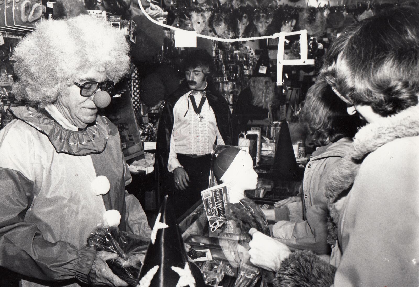 Customers crowded the aisles of Foy's store in Fairborn in 1983. Norman Foy (left) dressed as a clown and his son Mike dressed as a vampire as they assisted customers. DAYTON DAILY NEWS ARCHIVE