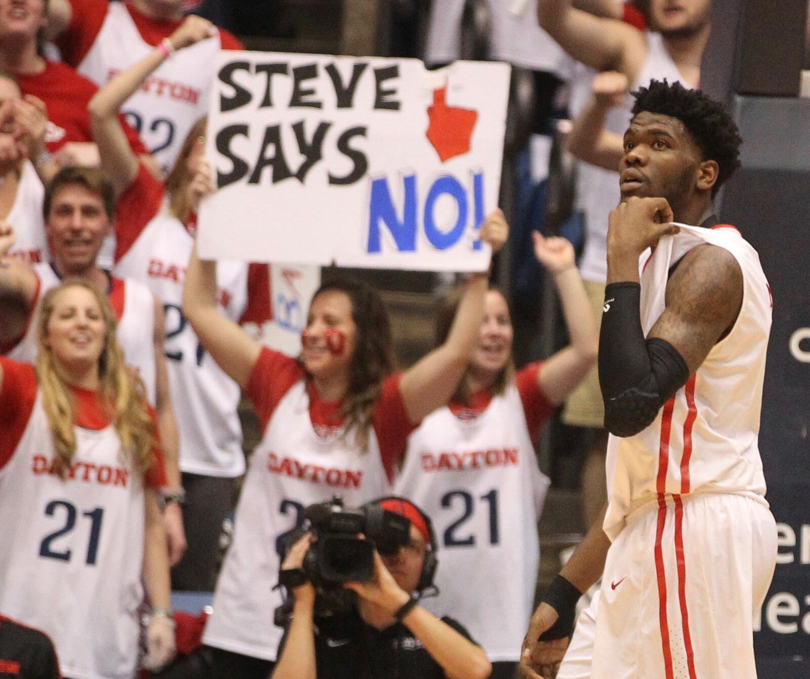 Dayton fans cheer for Steve McElvene after he blocked a shot against Virginia Commonwealth on Saturday, March 5, 20126, at UD Arena in Dayton. David Jablonski/Staff