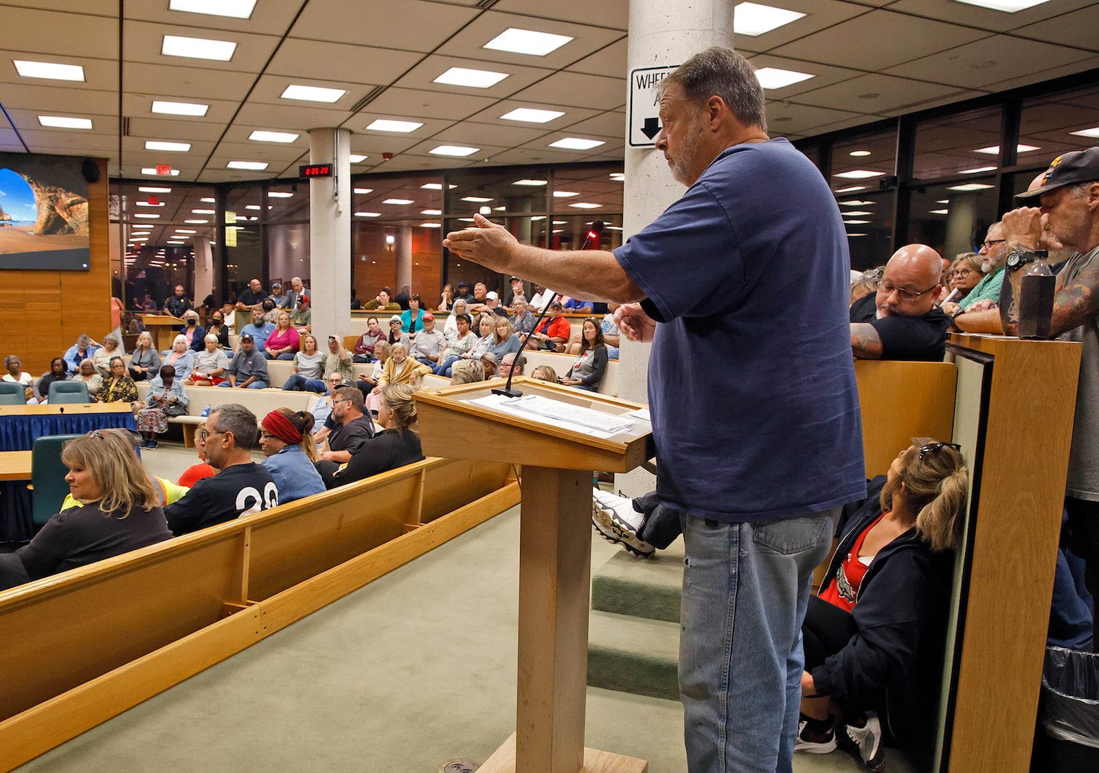 Mark Sanders addresses the Springfield City Commission about what he described as an immigrant crisis in the city during Tuesday's commission meeting. BILL LACKEY/STAFF