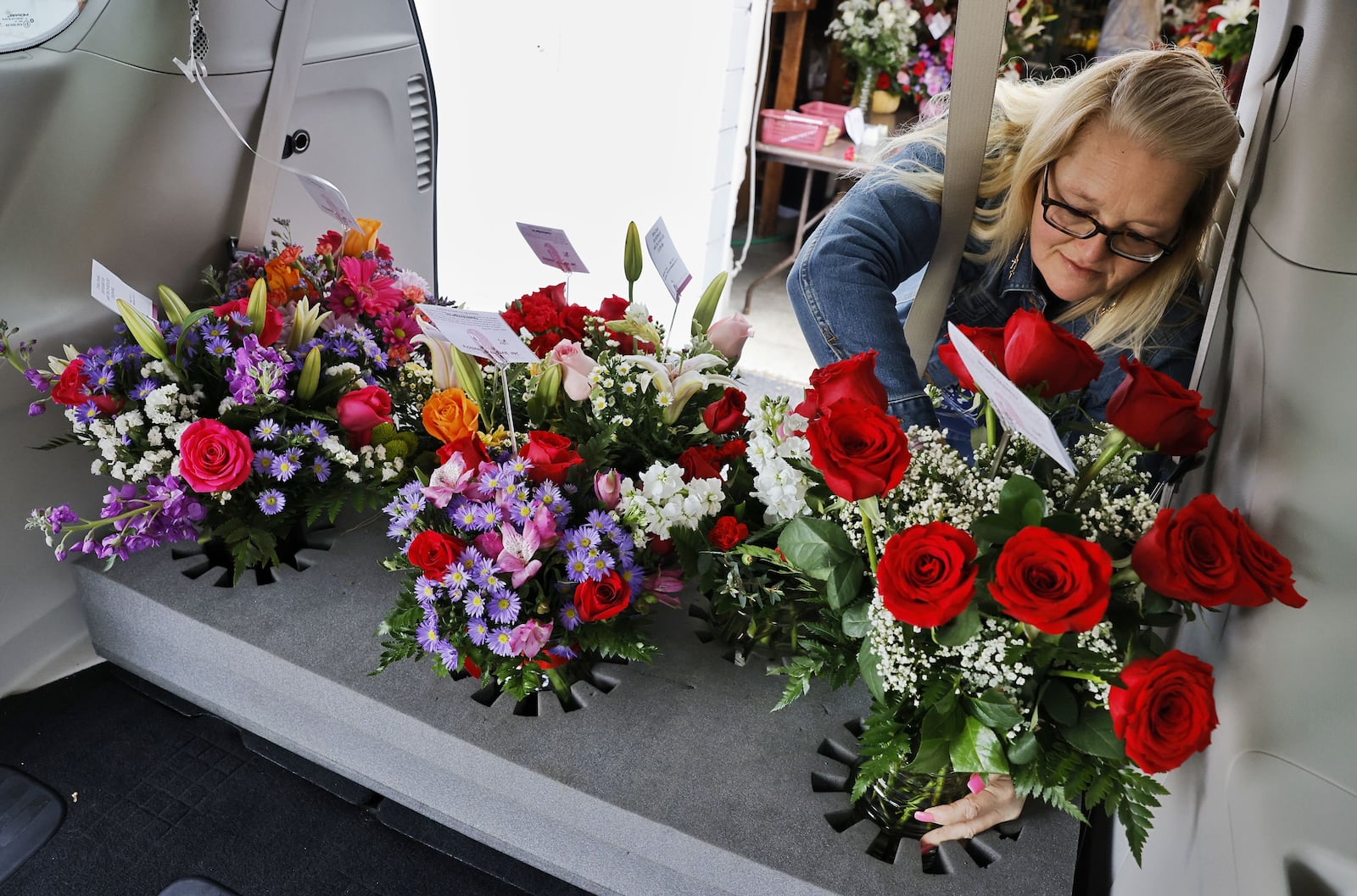 Amanda Reed gets Valentine's Day flower orders ready for delivery at Flowers By Roger Tuesday, Feb. 14, 2023 in Middletown. NICK GRAHAM/STAFF