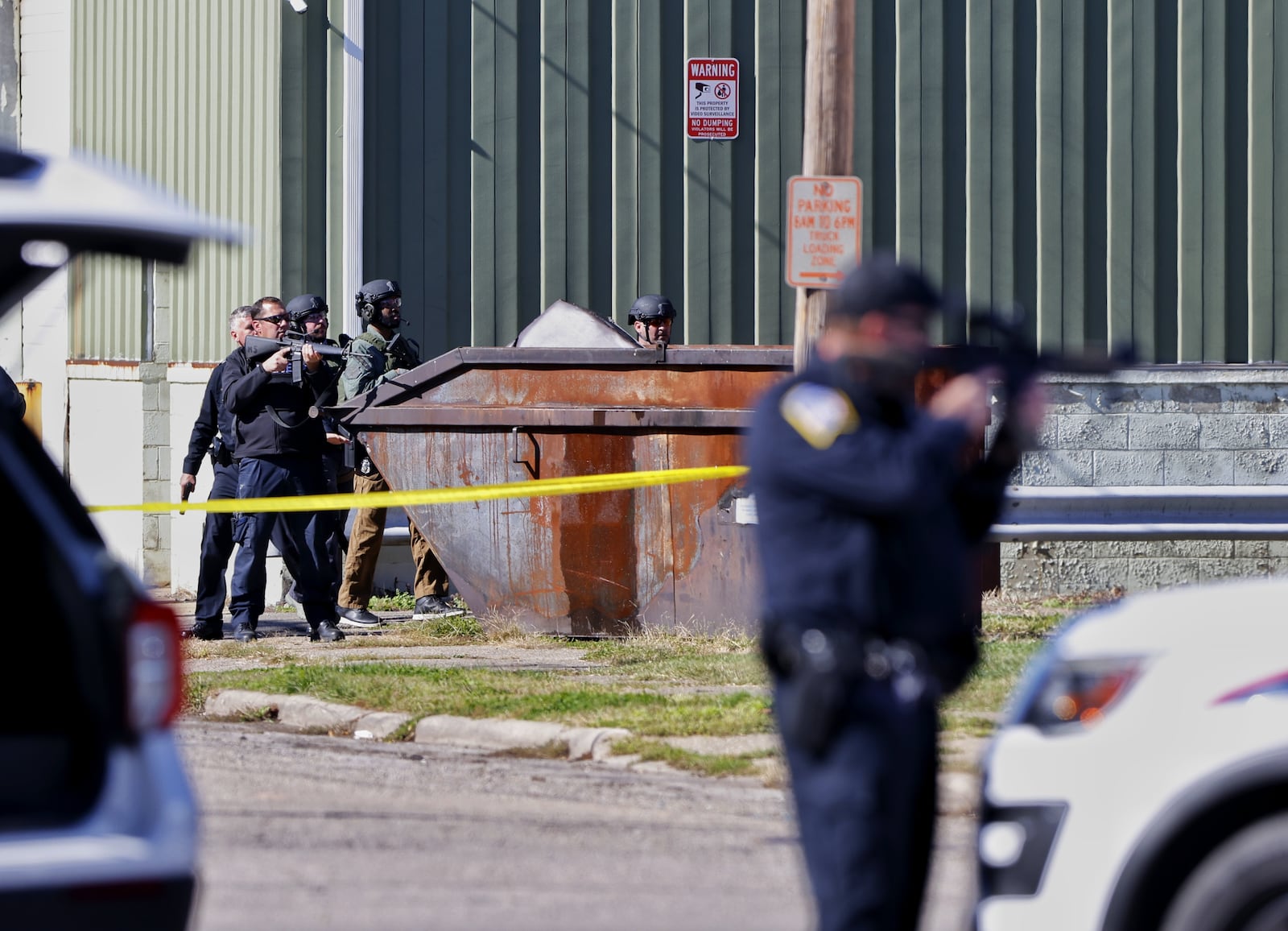 Middletown police surround a Charles Street building after a man reportedly fired a gun from an apartment window. NICK GRAHAM/STAFF