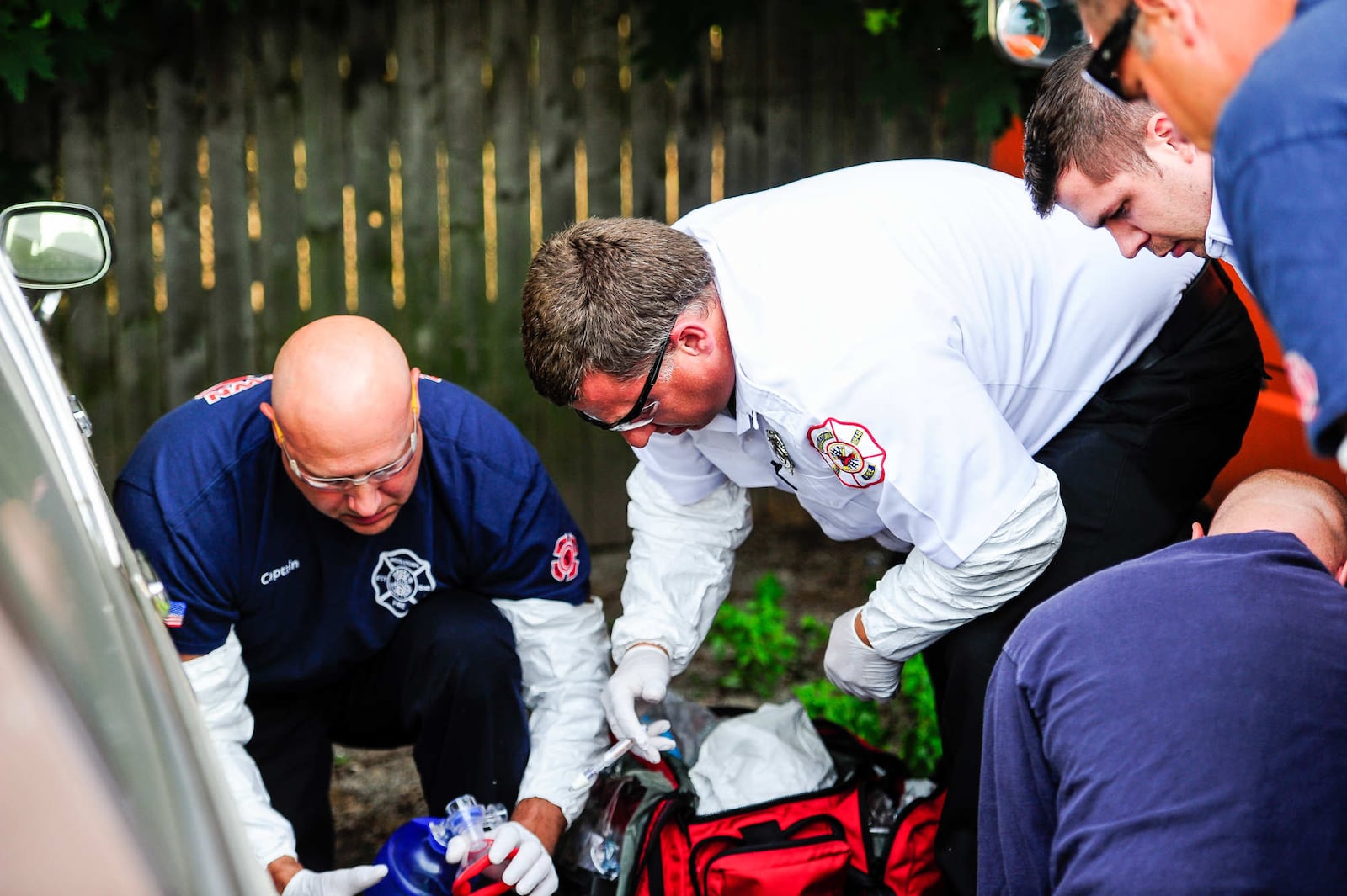 Middletown paramedics and police officers responded to a drug overdose behind the Midd-Town Carry Out on Central Avenue Monday, June 26 in Middletown. Emergency personnel found a man unconscious, lying between two vehicles across the alley. Paramedics first tried to start an IV, the fastest and most effective way to push Narcan into the mans system, and when that failed, Narcan was administered through the mans nose. Then a second IV was started. The entire time, paramedics bagged the gentleman until his oxygen level returned to normal. Two doses of Narcan, twice the normal amount, were used to revive the man, who was transported to Atrium. In the matter of a few minutes, all 17 emergency personnel working Monday night in the city were on calls and the dispatcher requested mutual aid from the Monroe Fire Department. One of those calls was an overdose.  NICK GRAHAM/STAFF