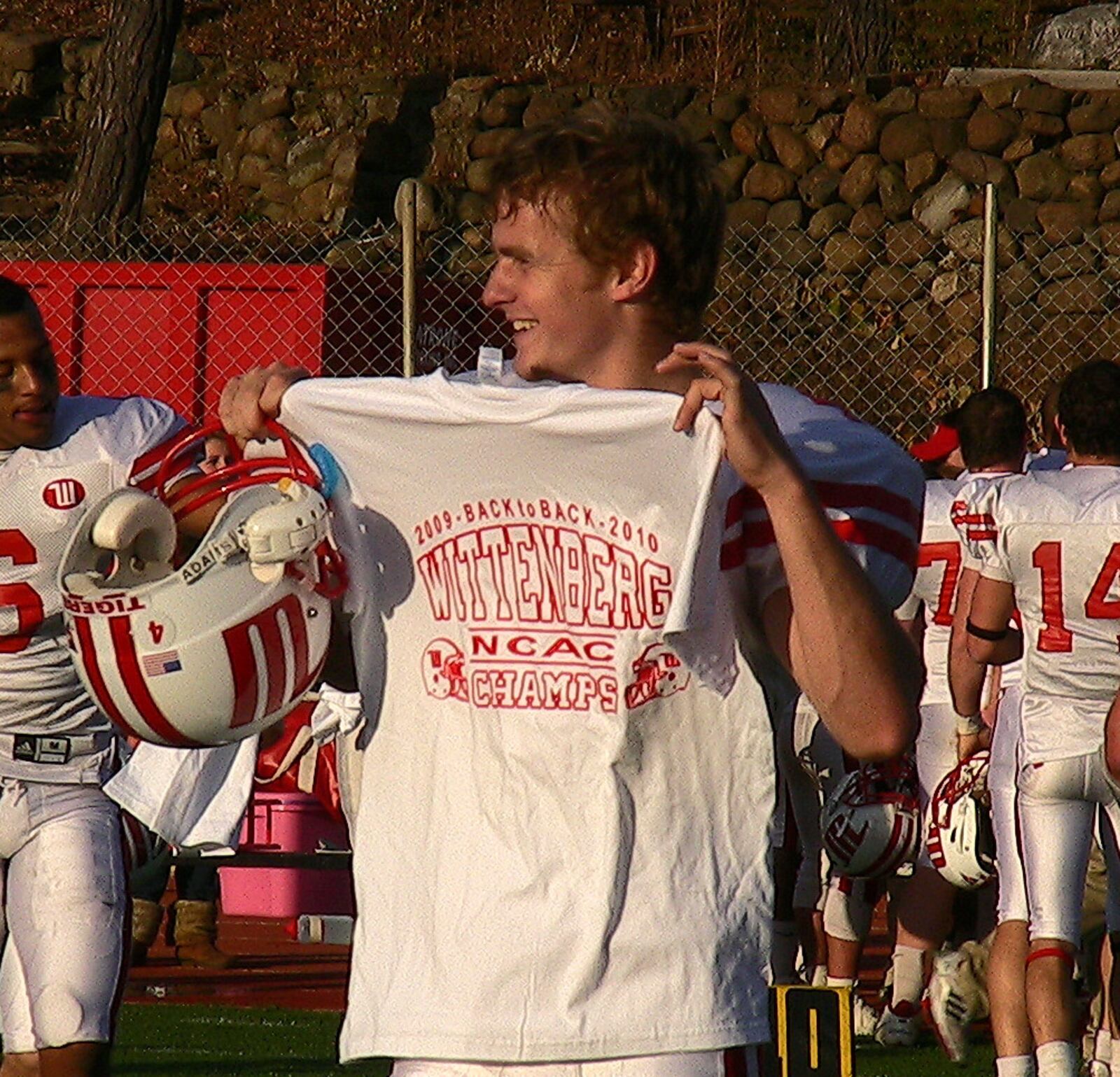 Kicker Sean Williams shows off a North Coast Athletic Conference championship T-shirt after Wittenberg beat Wooster 22-17 on Saturday, Nov. 13, 2010, at John P. Papp Stadium. Staff photo by David Jablonski