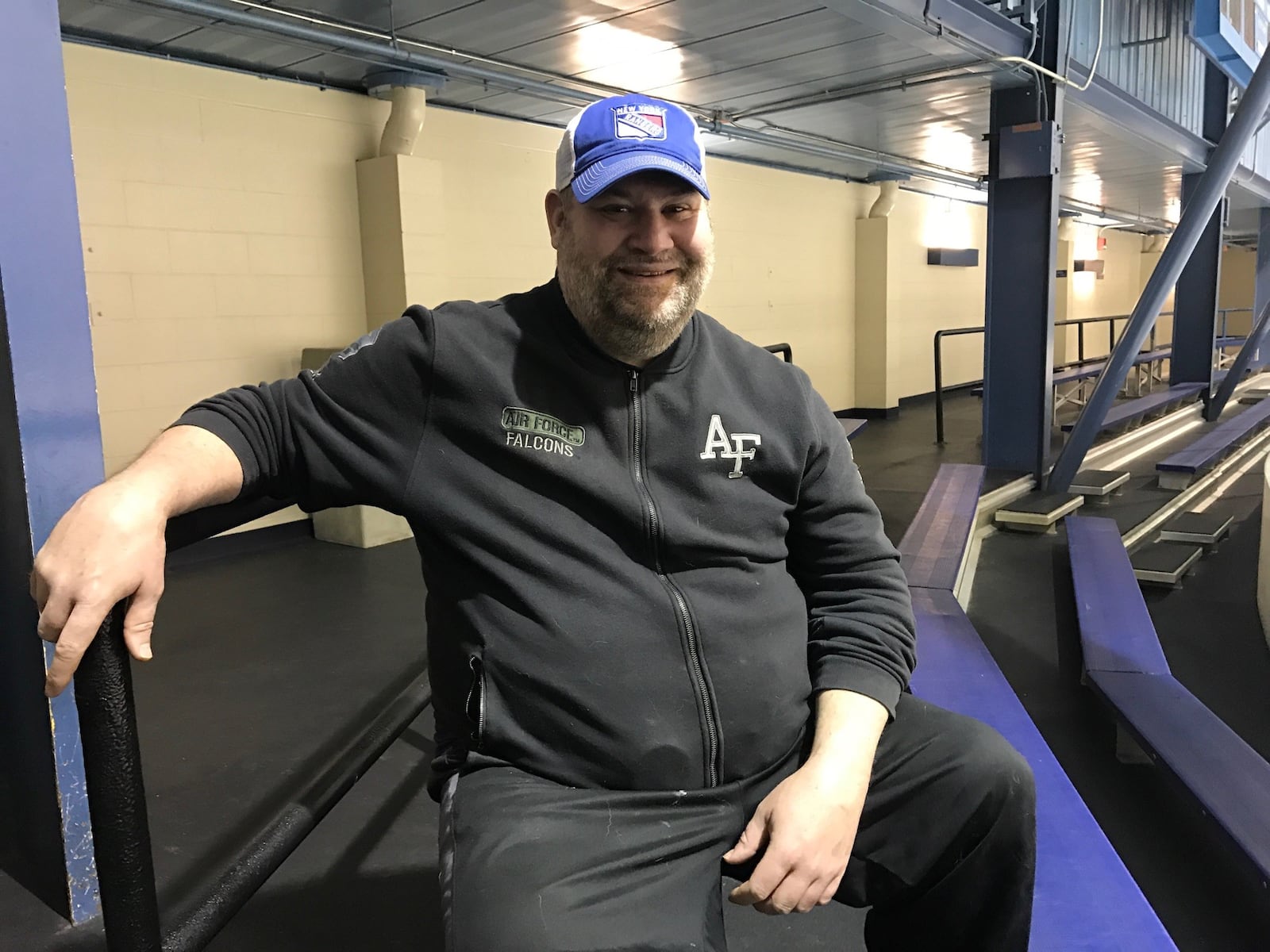 John “Sully: Sullivan watching a recent Huff-n-Puff hockey game at the Kettering Rec Center. A former Centerville High football captain and junior hockey standout, he starred at hockey powerhouse Culver Academy in Indiana and then played 3 ½ years for the U.S. Air Force Academy. In later years, he played in the Huff-n-Puff league. (Photo by Tom Archdeacon)