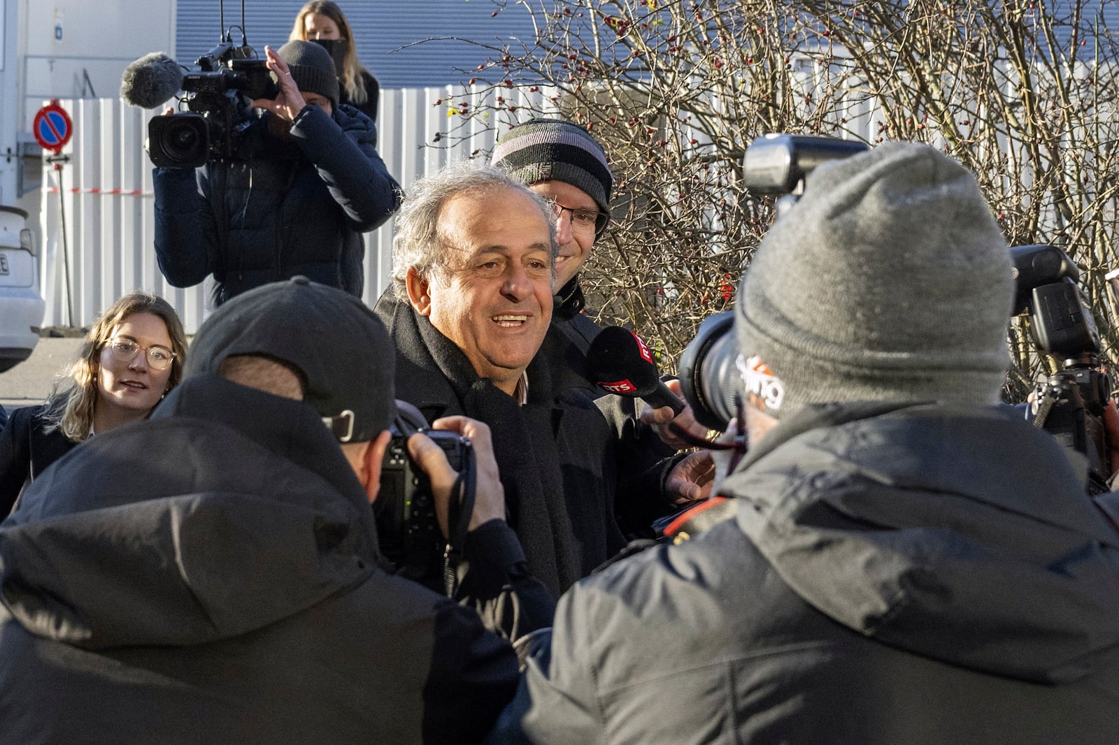 Michel Platini, center, former UEFA president and FIFA vice president, arrives for his retrial in front of the special appeals court, in Muttenz, Switzerland, Monday, March 3, 2025. (Urs Flueeler/Keystone via AP)