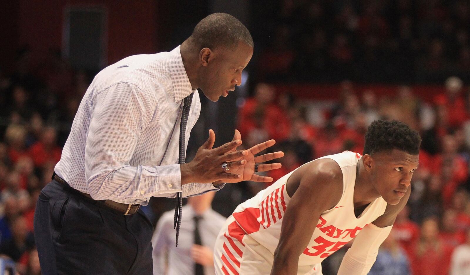 Dayton’s Anthony Grant talks to Dwayne Cohill during a game against Massachusetts on Saturday, Jan. 11, 2020, at UD Arena. David Jablonski/Staff