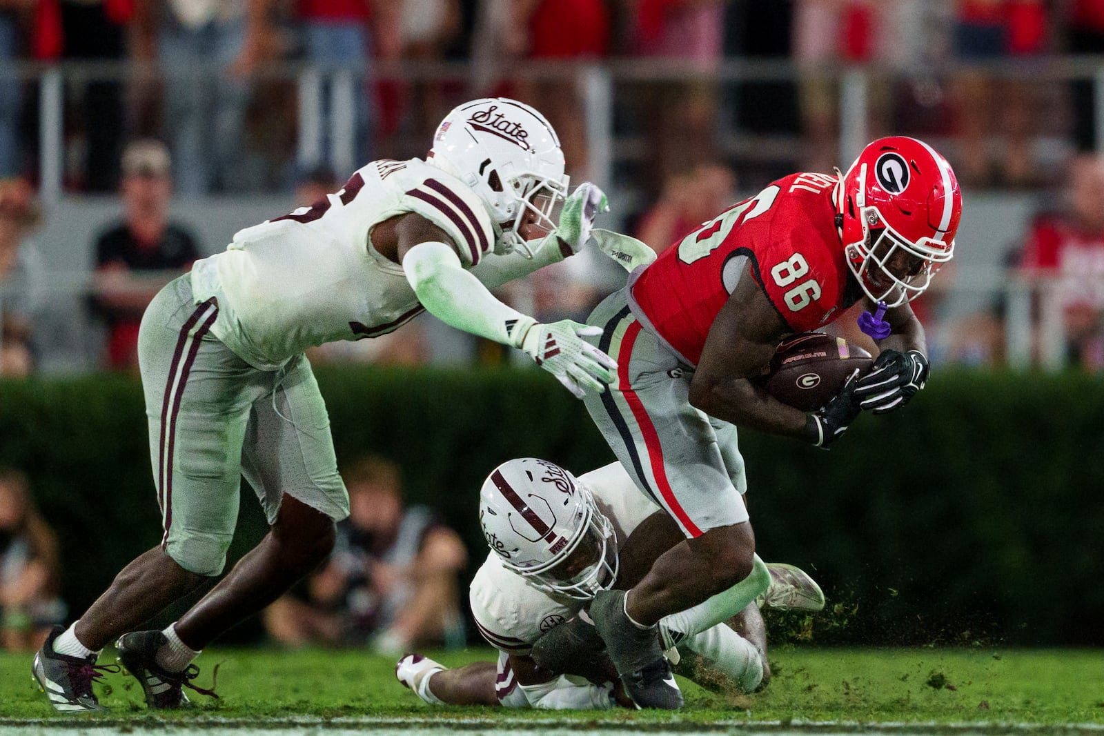 Georgia wide receiver Dillon Bell (86) is tackled after a reception during an NCAA college football game against Mississippi State, Saturday, Oct. 12, 2024, in Athens, Ga. (AP Photo/Jason Allen)