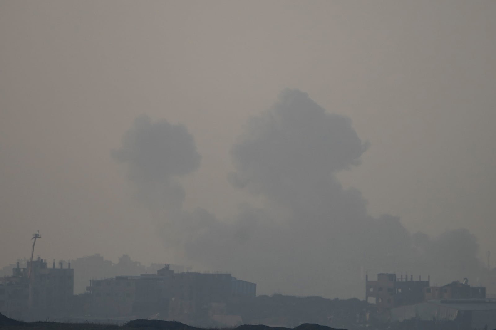 Smoke rises following an Israeli airstrike in the Gaza Strip, as seen from southern Israel, Thursday, Jan. 16, 2025. (AP Photo/Ariel Schalit)