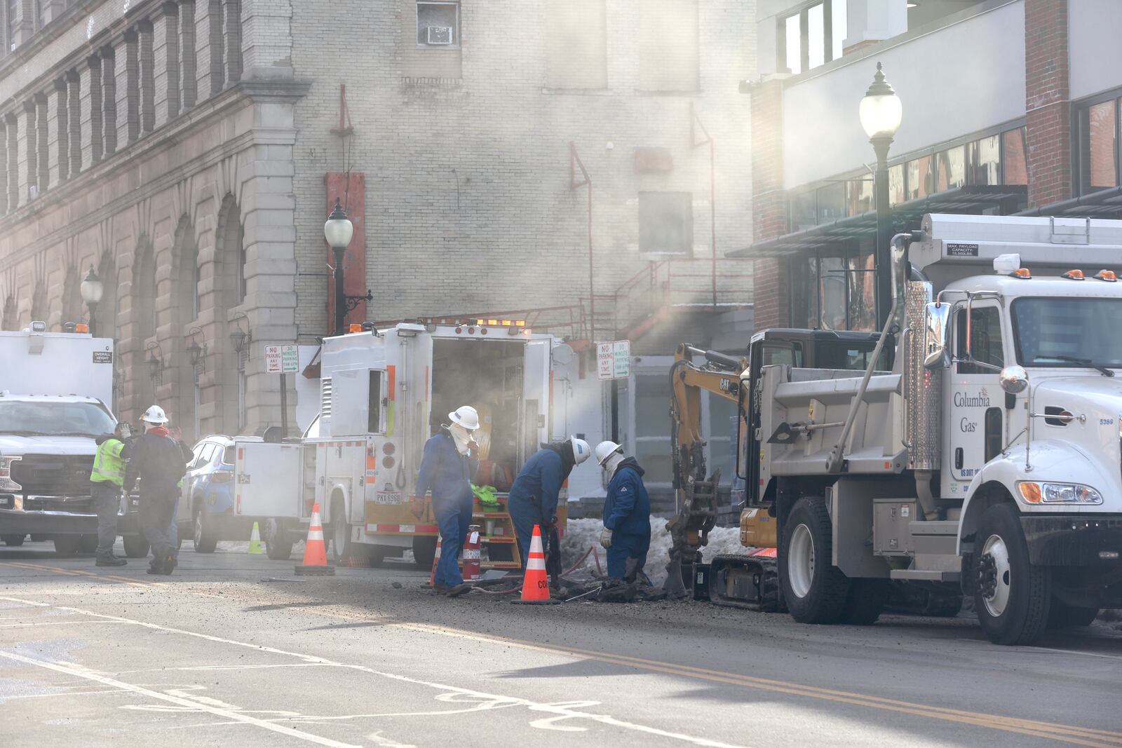 A cloud of gas is visible as Columbia Gas workers try to stop a leak in a gas main Wednesday, Feb. 9, 2022, on North Fountain Avenue in downtown Springfield. Fountain Avenue was closed as gas roared out. BILL LACKEY/STAFF