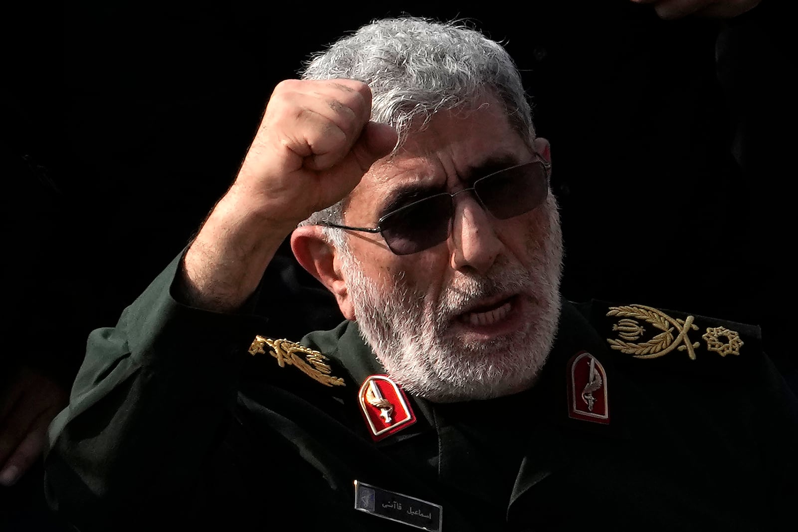 Commander of Iran's Revolutionary Guard Quds Force, Gen. Esmail Qaani, chants a slogan "Death to Israel" during the funeral ceremony of the late Revolutionary Guard Gen. Abbas Nilforushan, who was killed in an Israeli airstrike in Beirut in late September, in Tehran, Iran, Tuesday, Oct. 15, 2024. (AP Photo/Vahid Salemi)