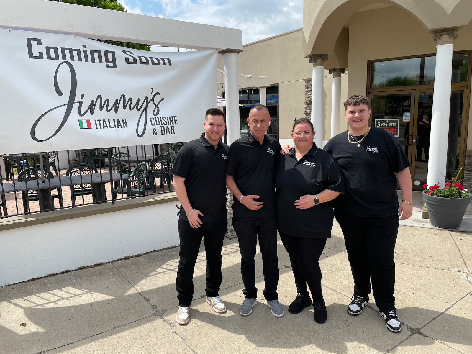 Jimmy’s Italian Cuisine & Bar is opening its doors in downtown Dayton at 824 E. Fifth St. on Wednesday, May 1. Pictured is Owner Mo Jusufi with his wife, Mira, and two sons. NATALIE JONES/STAFF