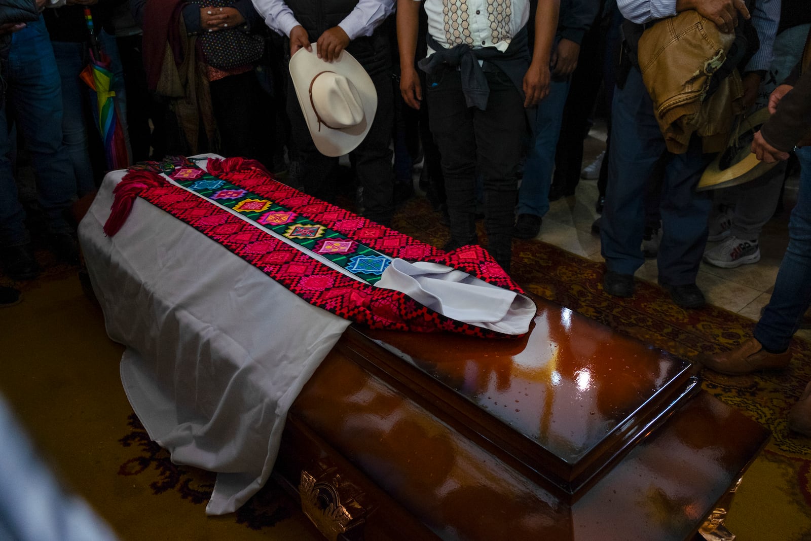 A tunic lies on the coffin of Catholic priest Marcelo Perez, who was killed in San Cristobal de las Casas, Chiapas state, Mexico, Sunday, Oct. 20, 2024. (AP Photo/Isabel Mateos)