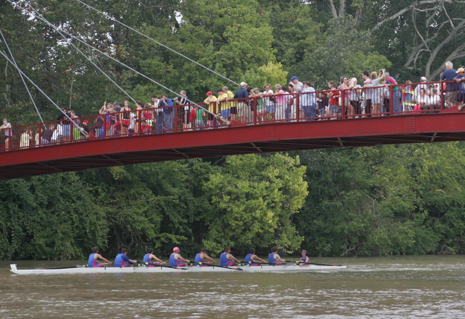 25 Sept 05 Photo by Ron Alvey. People line the Gayle B. Price Jr. Bridge, at Island Park, to watch the Five Rivers Fall Regatta. The event, started in 1995, was scheduled to have 233 boats and 1,100 rowers compete.