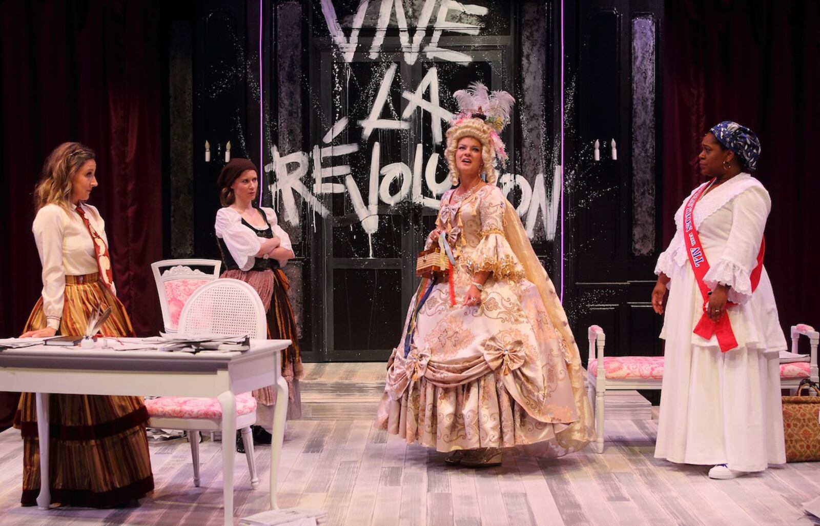 (left to right) Ginna Hoben (Olympe de Gouges), Tess Talbot (Charlotte Corday, Maggie Lou Rader (Marie Antoinette) and Torie Wiggins (Marianne Angelle) in the Human Race Theatre Company's production of "The Revolutionists."