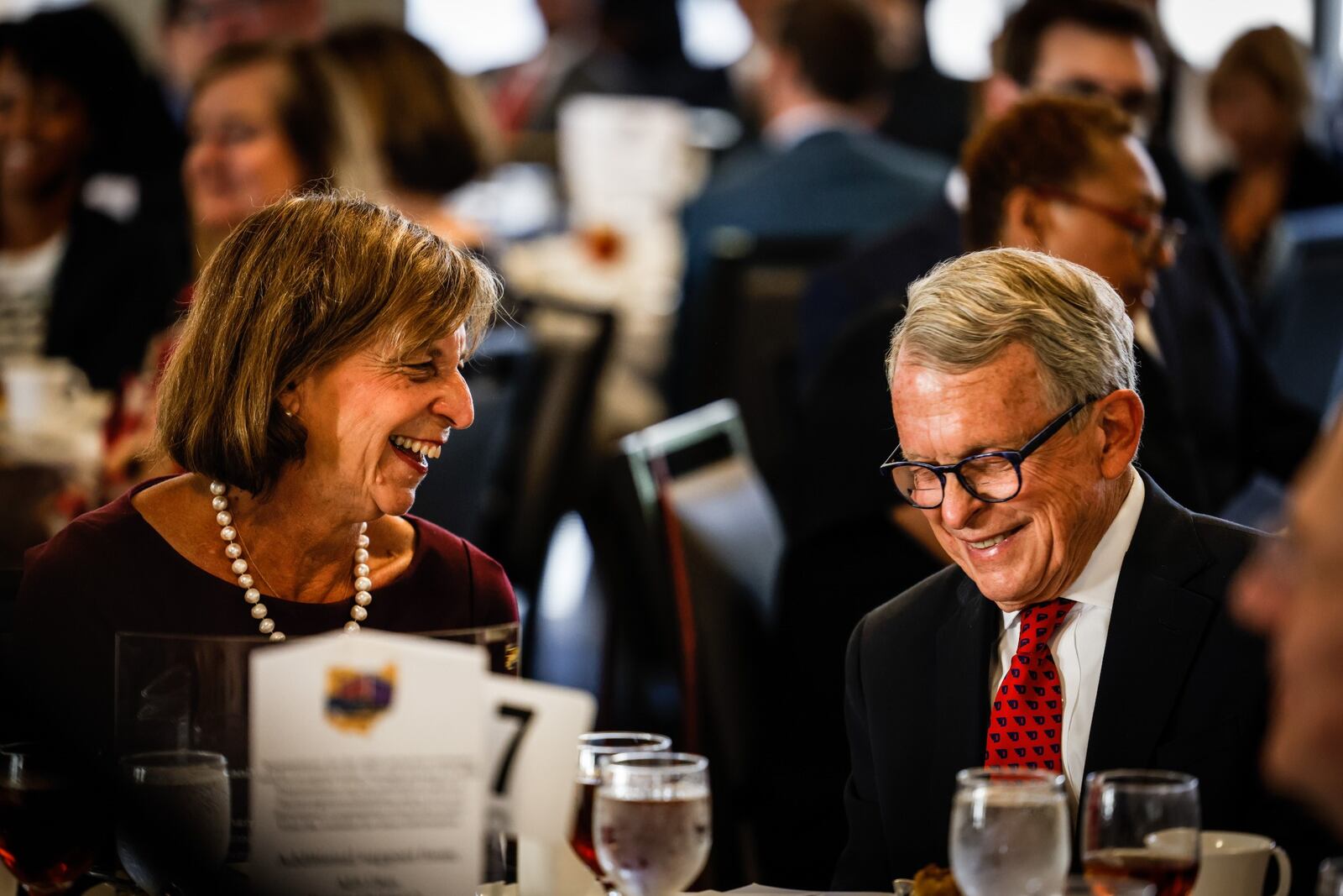 Fran and Gov. Mike DeWine react to comments by the MC during the 2020 Dayton Walk of Fame celebration held Tuesday morning Oct. 12, 2021 at Sinclair Community College. The Walk of Fame recognizes the lives of accomplishments of individuals from the Greater Miami Valley area. Some notables from Tuesday event are, Gov. Mike DeWine and Springfield entertainer, John Legend. JIM NOELKER/STAFF