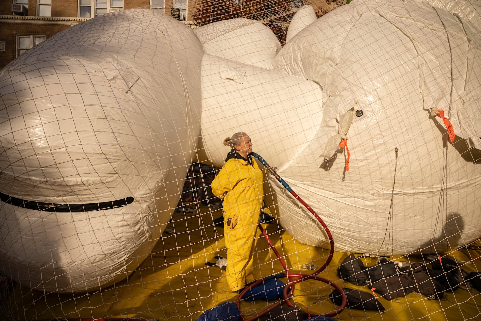 A person inflates a float in preparation for the Macy's Thanksgiving Day Parade, Wednesday, Nov. 27, 2024, in New York. (AP Photo/Yuki Iwamura)