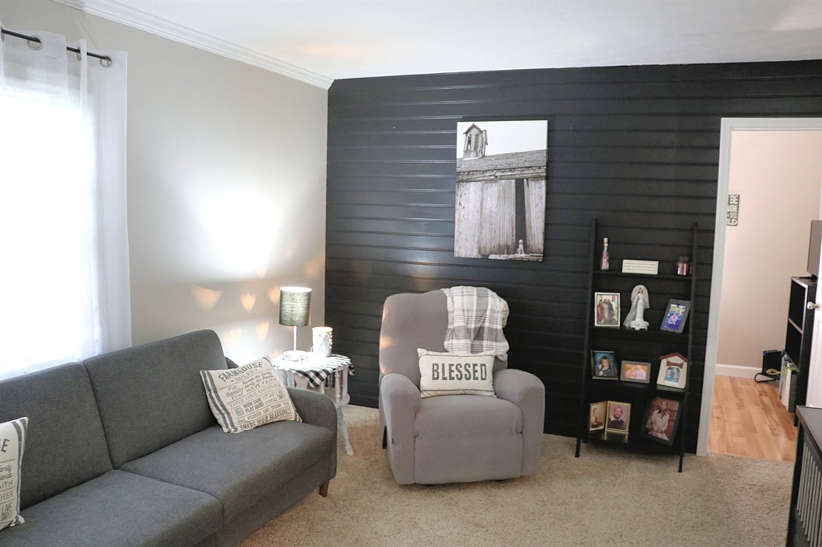 Renovation turned one room into a den or small family room with a shiplap accented wall. KATHY TYLER/CONTRIBUTOR