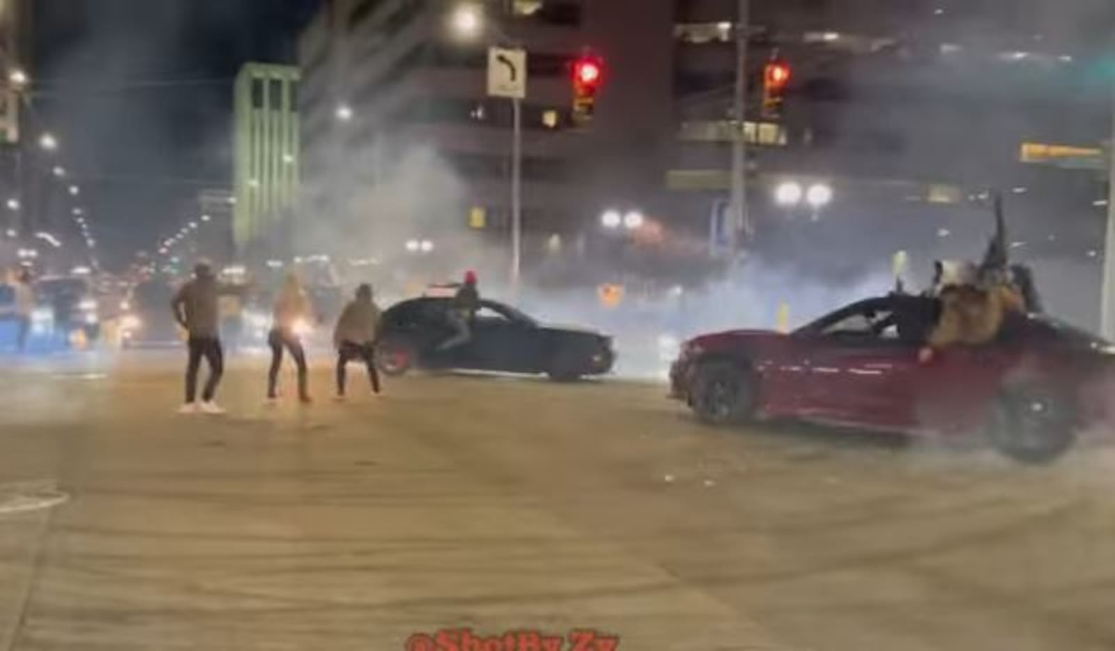 Cars do donuts and drive in circles at East Third Street and Jefferson Street in downtown Dayton earlier this year. YOUTUBE