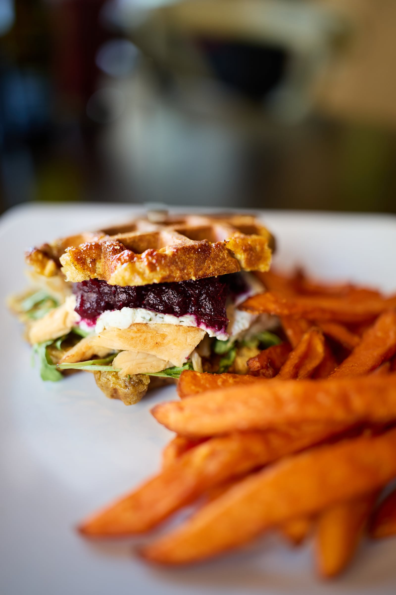 Taste of Belgium is introducing a new Thanksgiving Waffle featuring a pumpkin-infused waffle split in two that’s topped with roasted turkey, arugula, cranberry sauce and cheese. The waffle is served alongside sweet potato fries (CONTRIBUTED PHOTO).