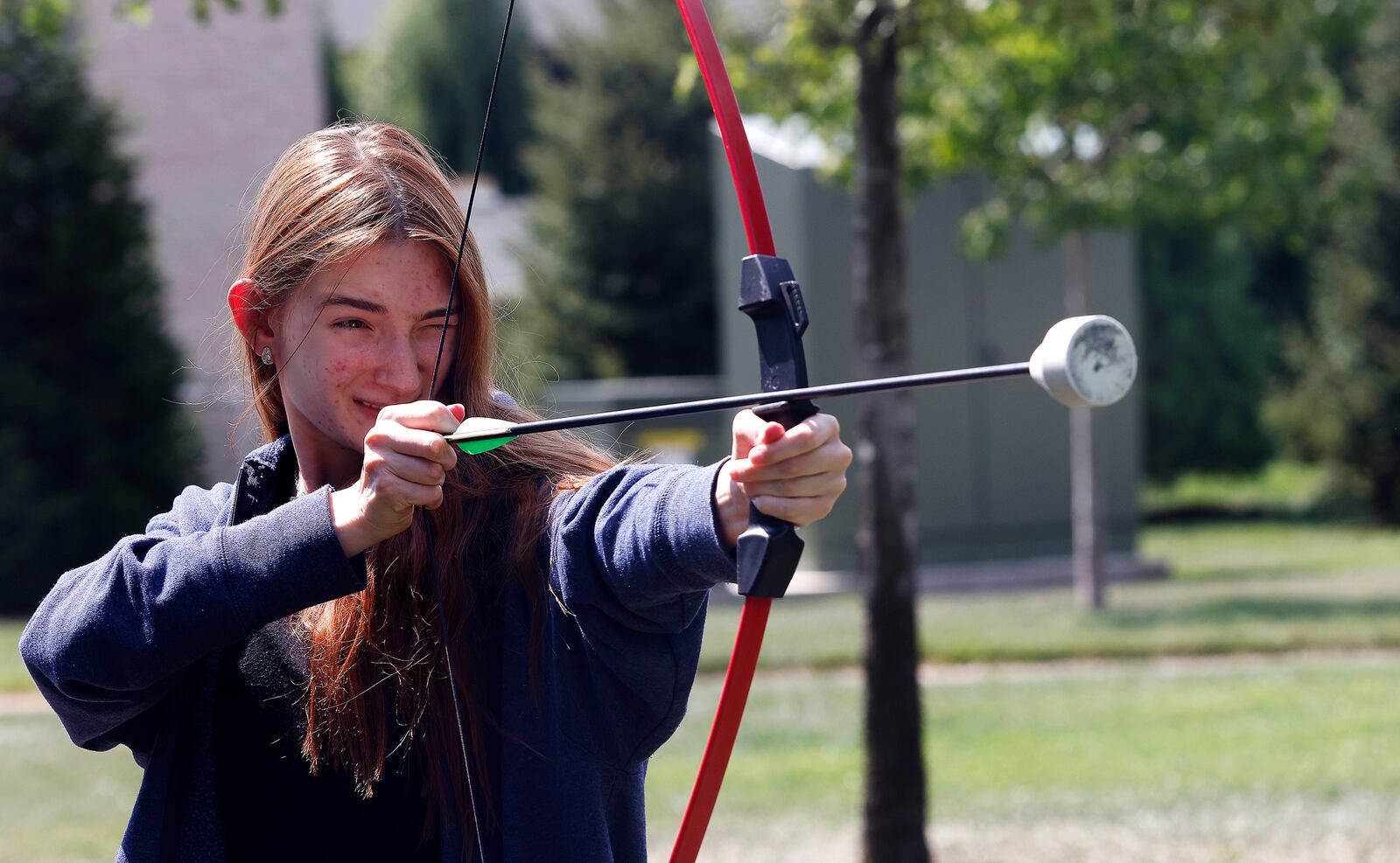 First year Sinclair Community College student, Alisa Romenskaya participated in archery Thursday, Aug. 29, 2024 at the Tartan Lawn Party as part of Sinclair Community College welcome week celebration. MARSHALL GORBY\STAFF