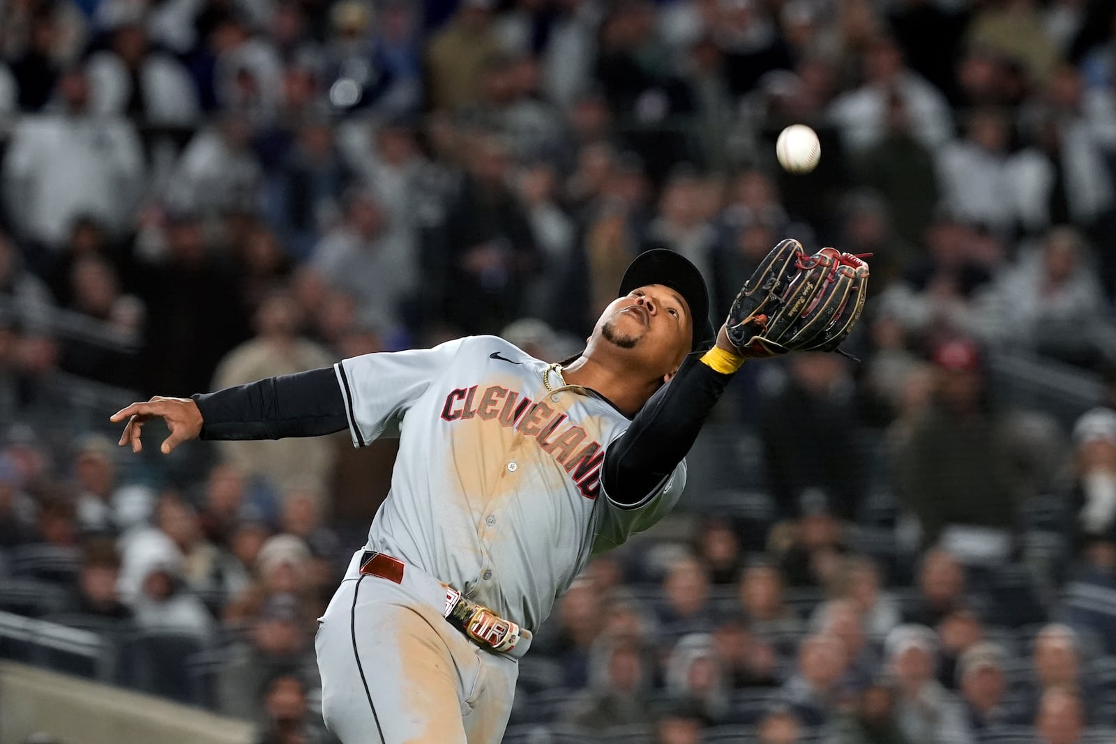 Cleveland Guardians third baseman José Ramírez catches a pop fly by New York Yankees' Austin Wells during the fifth inning in Game 2 of the baseball AL Championship Series Tuesday, Oct. 15, 2024, in New York. (AP Photo/Godofredo Vásquez )