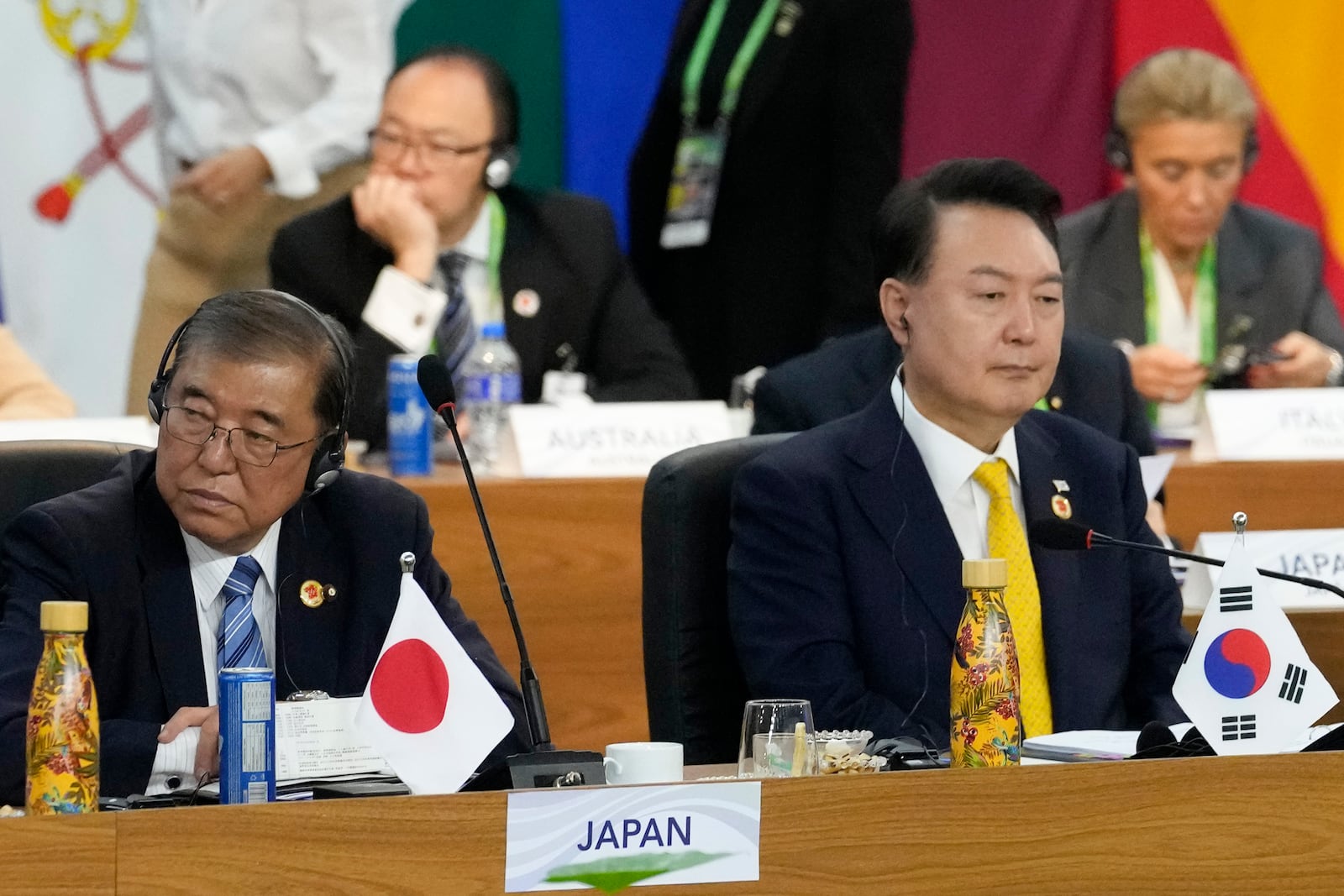 Japan's Prime Minister Shigeru Ishiba, left, and South Korea's President Yoon Suk Yeol attend the G20 Summit leaders meeting in Rio de Janeiro, Monday, Nov. 18, 2024. (AP Photo/Eraldo Peres)