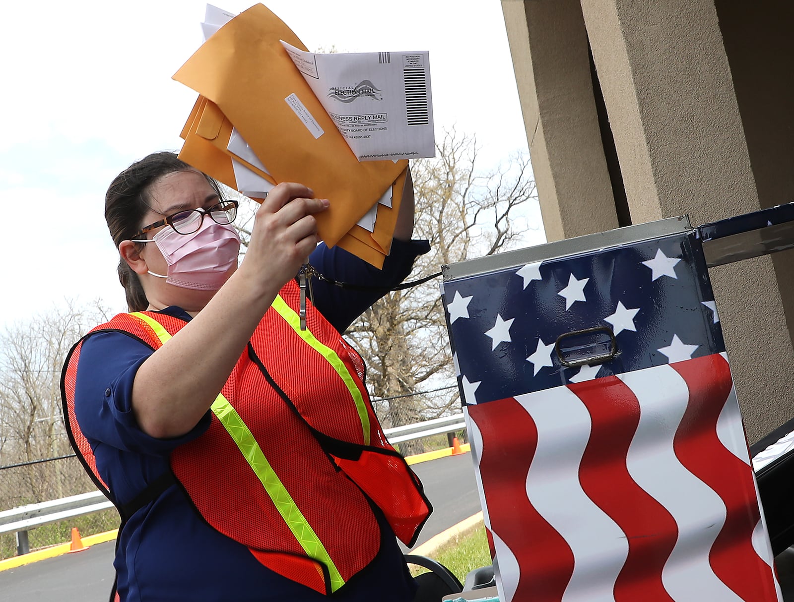 Amber Lopez, the Deputy Director of the Clark County Board of Elections, empties the ballot box at the drop off at the Clark County Board of Elections Tuesday. BILL LACKEY/STAFF