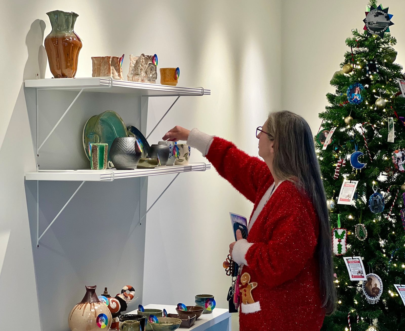 FILE PHOTO: A visitor to Rosewood Arts Center looks at pieces of art for sale. AIMEE HANCOCK/STAFF