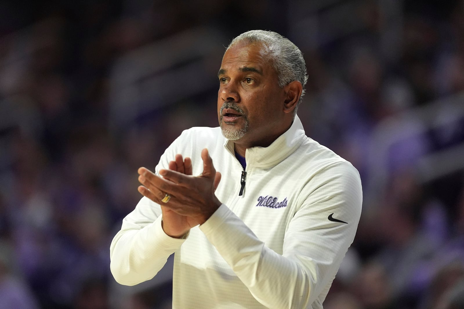 Kansas State head coach Jerome Tang watches during the first half of an NCAA college basketball game against Cincinnati, Monday, Dec. 30, 2024, in Manhattan, Kan. (AP Photo/Charlie Riedel)