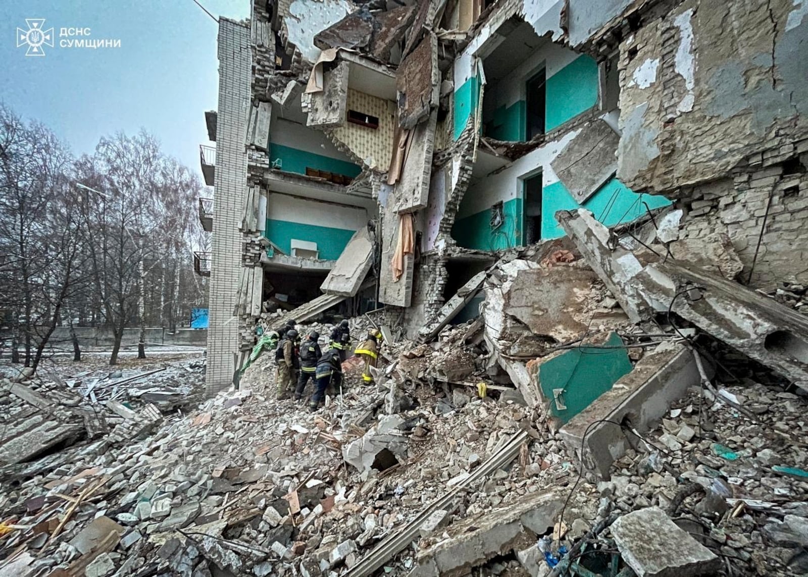 In this photo provided by the Ukrainian Emergency Services on Nov. 19, 2024, rescue workers clear the rubble of a residential building destroyed by a Russian strike in Hlukhiv, Ukraine. (Ukrainian Emergency Service via AP)