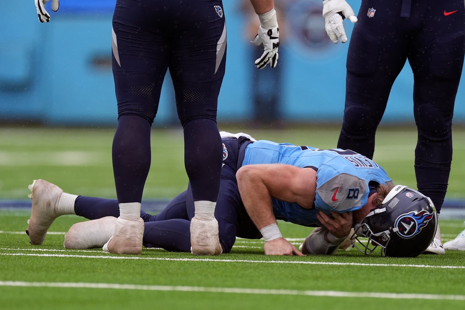 Tennessee Titans quarterback Will Levis holds his shoulder after he was injured on a play against the Jacksonville Jaguars during the first half of an NFL football game, Sunday, Dec. 8, 2024, in Nashville, Tenn. (AP Photo/George Walter IV)