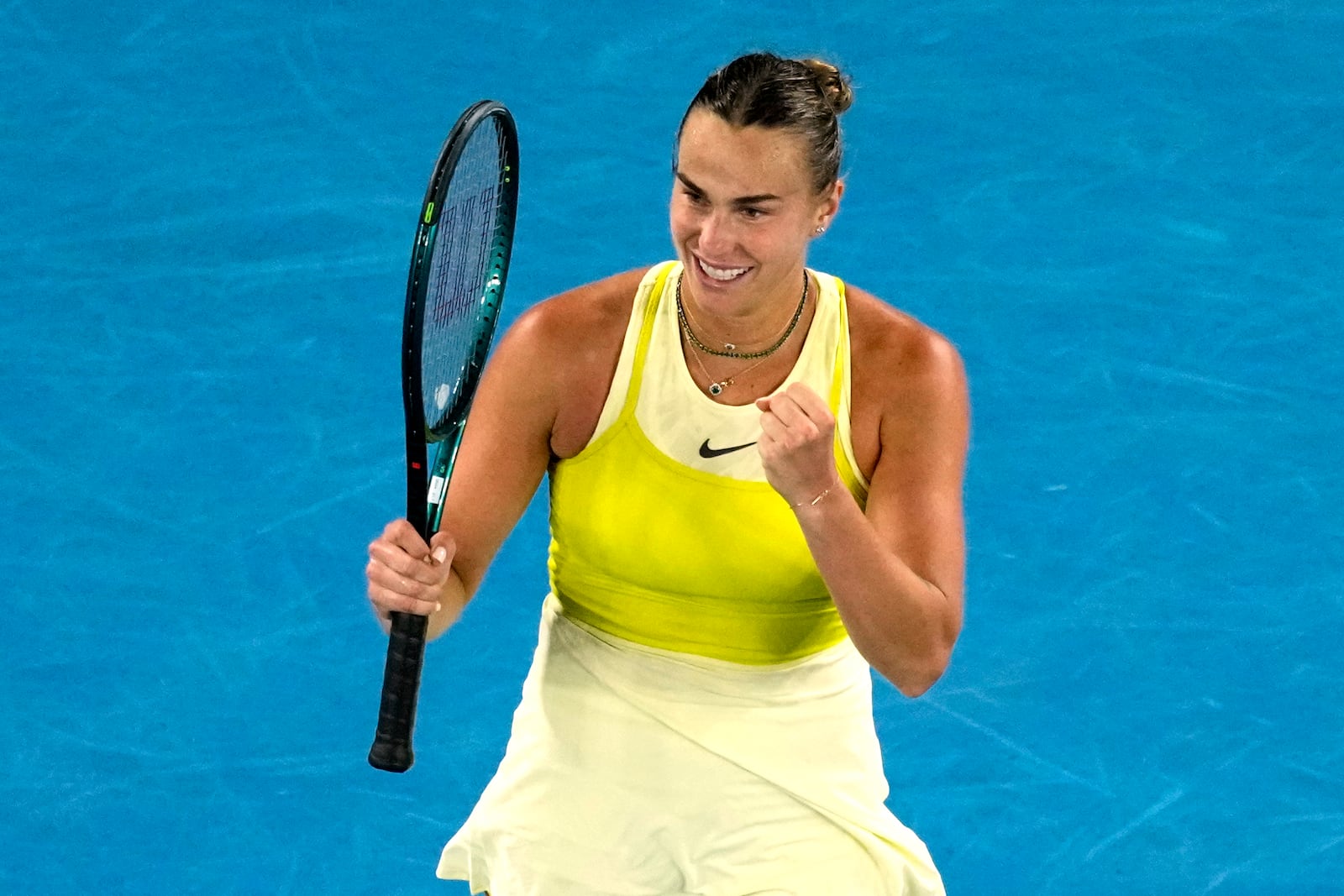 Aryna Sabalenka of Belarus celebrates after defeating Anastasia Pavlyuchenkova of Russia in their quarterfinal match at the Australian Open tennis championship in Melbourne, Australia, Tuesday, Jan. 21, 2025. (AP Photo/Vincent Thian)