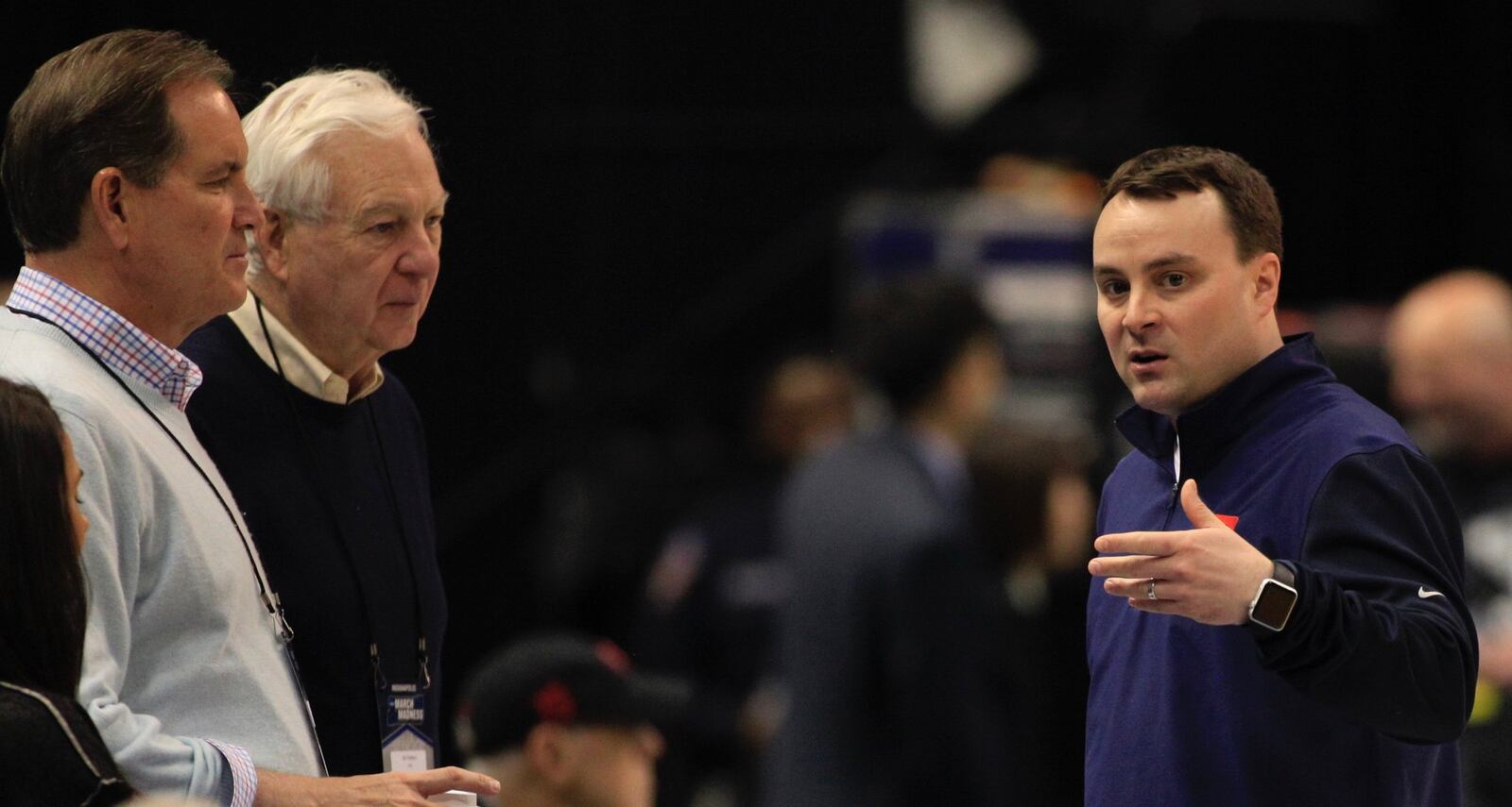 Dayton’s Archie Miller, right, talks to Jim Nantz and Bill Raftery, of CBS, during a NCAA tournament practice on Thursday, March 16, 2017, at Bankers Life Fieldhouse in Indianapolis. David Jablonski/Staff