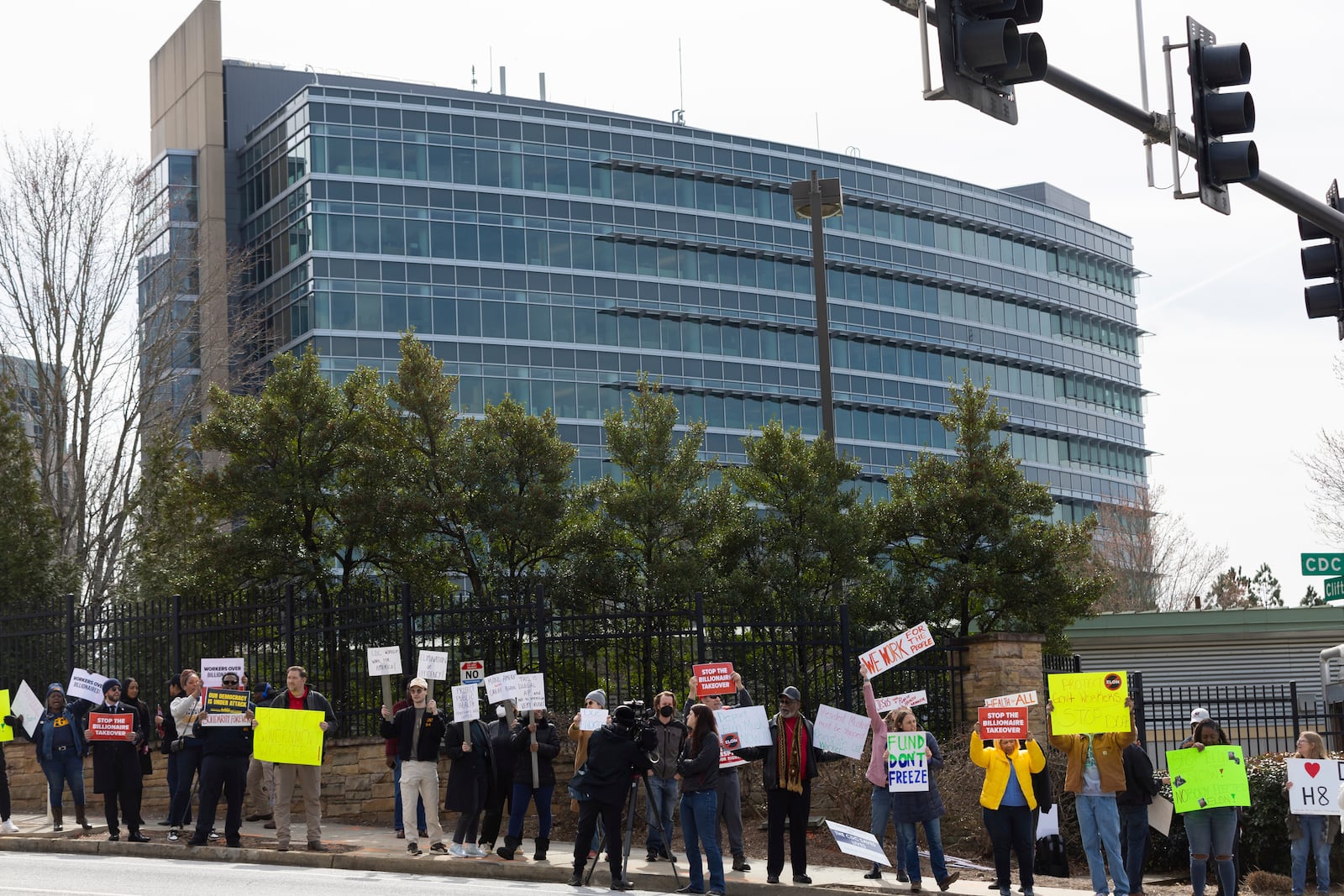 FILE - Demonstrators protest Centers for Disease Control and Prevention (CDC) layoffs in front of the CDC headquarters in Atlanta, Feb. 18, 2025. (Arvin Temkar/Atlanta Journal-Constitution via AP, file)