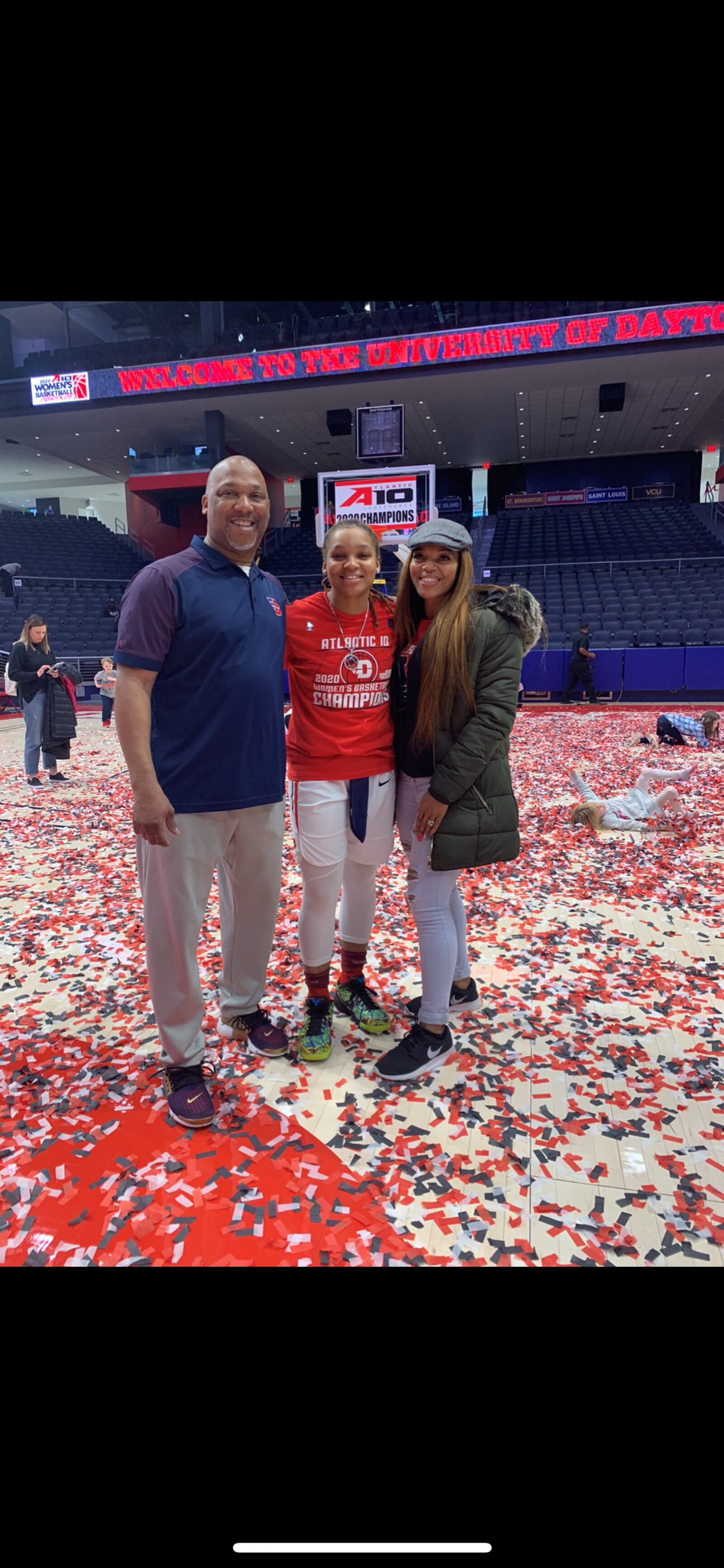 The Bradshaws at UD Arena after UD women won A-10 Tournament in March.( left to right) dad Eric, Araion, mom Kelley. CONTRIBUTED