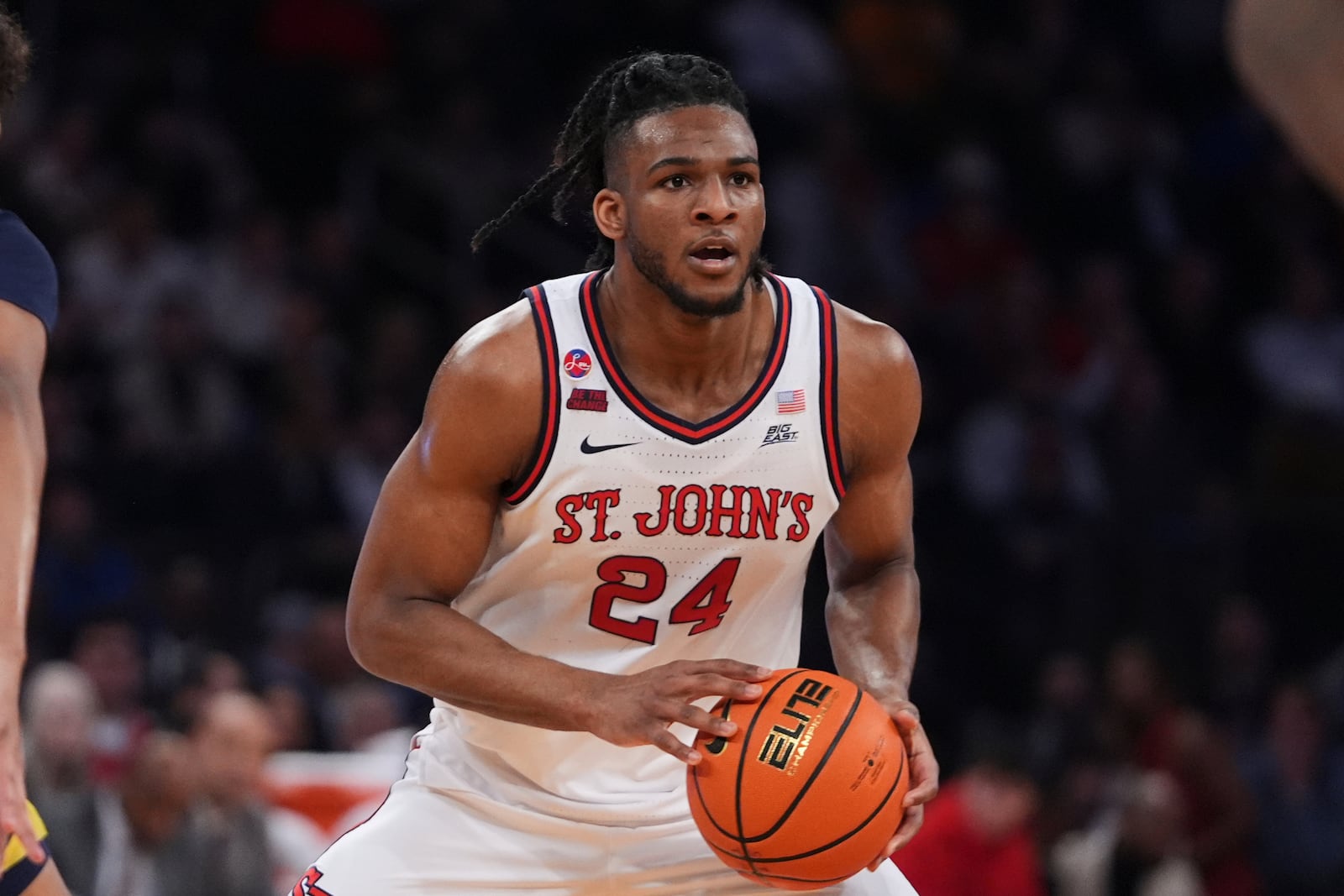 St. John's's Zuby Ejiofor (24) looks to pass during the first half of an NCAA college basketball game against the Marquette in the semifinals of the Big East tournament Friday, March 14, 2025, in New York. (AP Photo/Frank Franklin II)