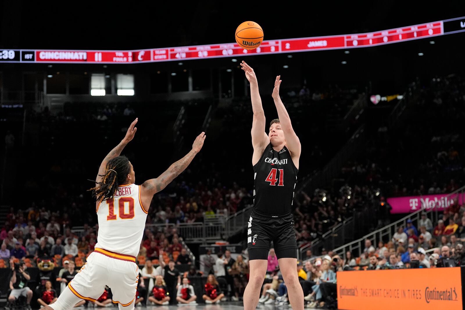 Cincinnati's Simas Lukosius (41) shoots over Iowa State's Keshon Gilbert (10) during the first half of an NCAA college basketball game in the second round of the Big 12 Conference tournament, Wednesday, March 12, 2025, in Kansas City, Mo. (AP Photo/Charlie Riedel)