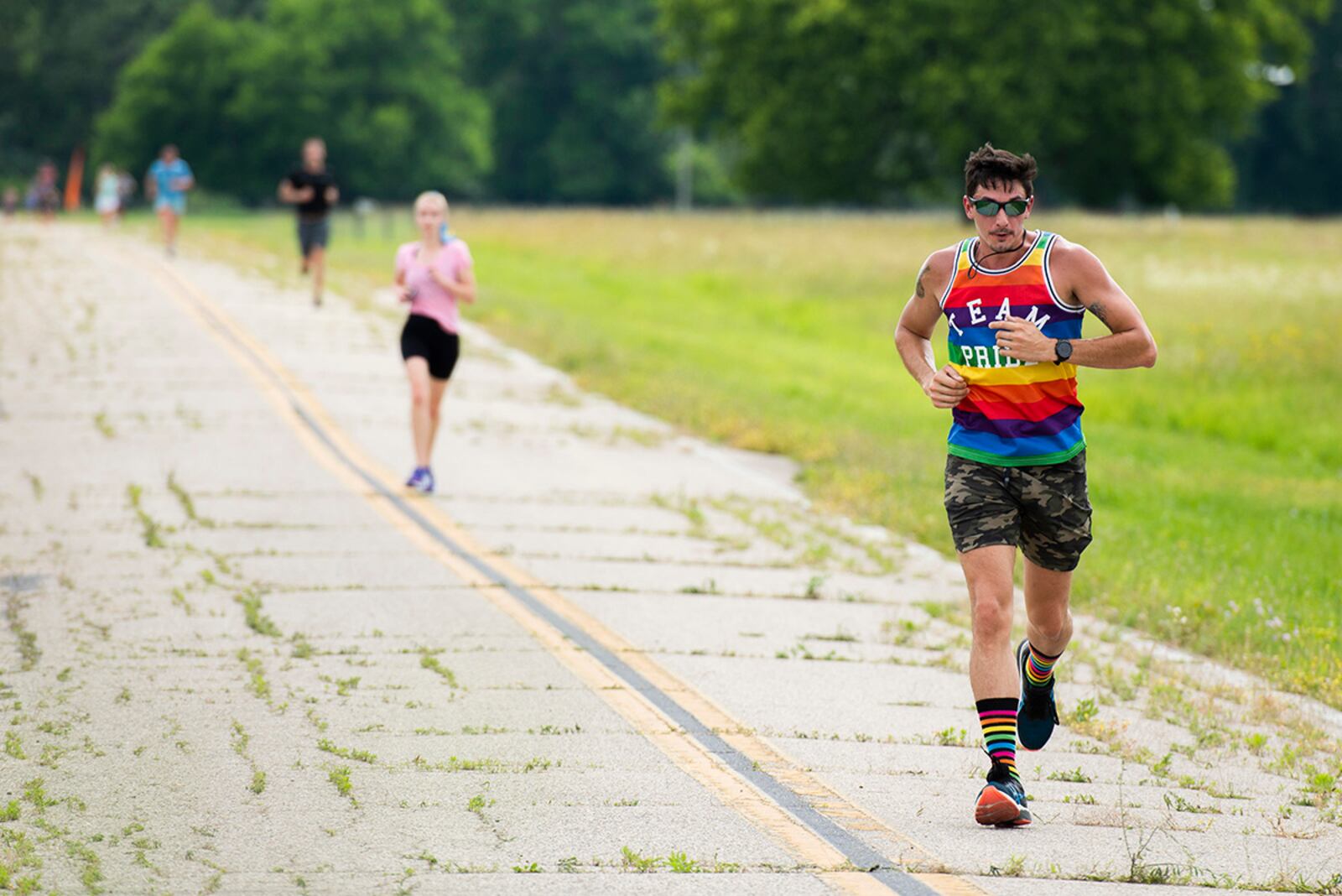 Runners move through Huffman Prairie on June 24 during the Pride Month 5K at Wright-Patterson Air Force Base. Pride Month celebrates members of the LGBTQ community. U.S. AIR FORCE PHOTO/WESLEY FARNSWORTH