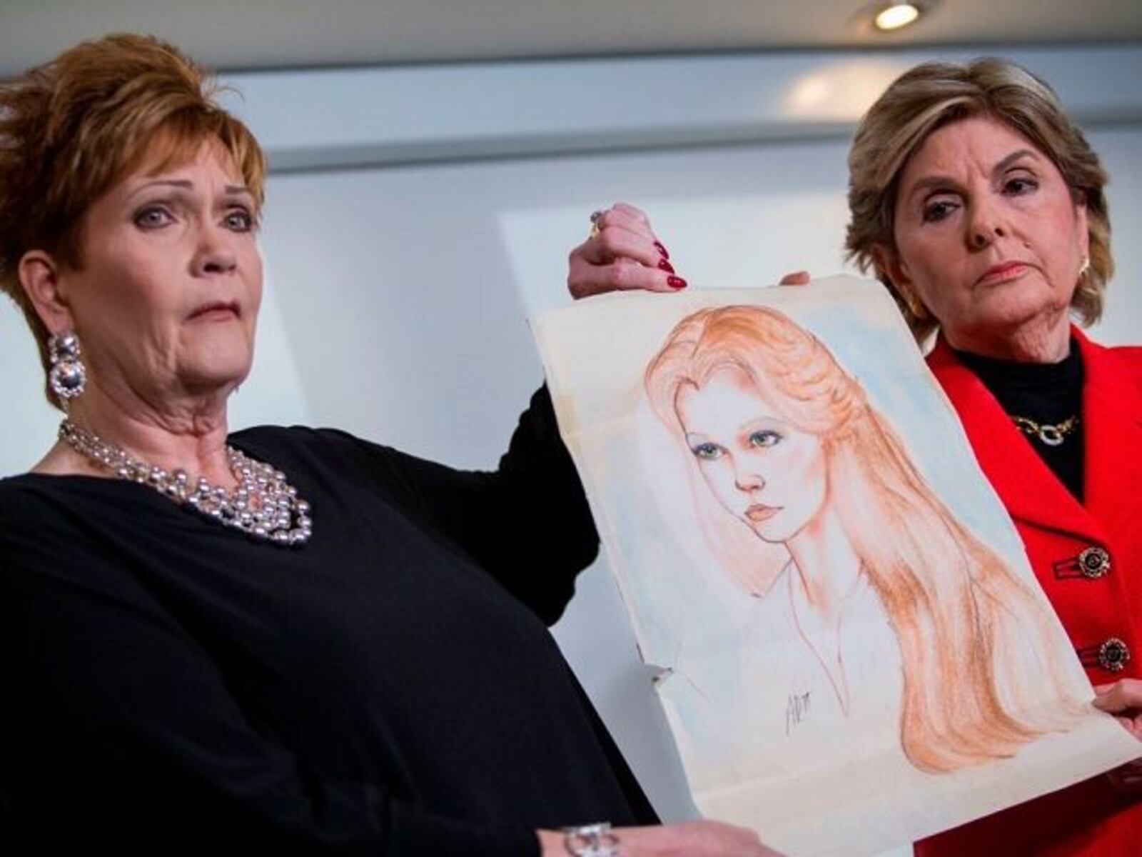 Attorney Gloria Allred (R) and Beverly Young Nelson hold up a drawing of Nelson when she was younger during a press conference on November 13, 2017, in New York, alledging that Roy Moore sexually assaulted Nelson when she was a minor in Alabama without her consent.
The US Senate's top Republican on Monday urged scandal-hit conservative Roy Moore to end his Senate campaign,  saying he believes the women who have accused the Christian evangelical candidate of sexual misconduct. / AFP PHOTO / EDUARDO MUNOZ ALVAREZ        (Photo credit should read EDUARDO MUNOZ ALVAREZ/AFP/Getty Images)