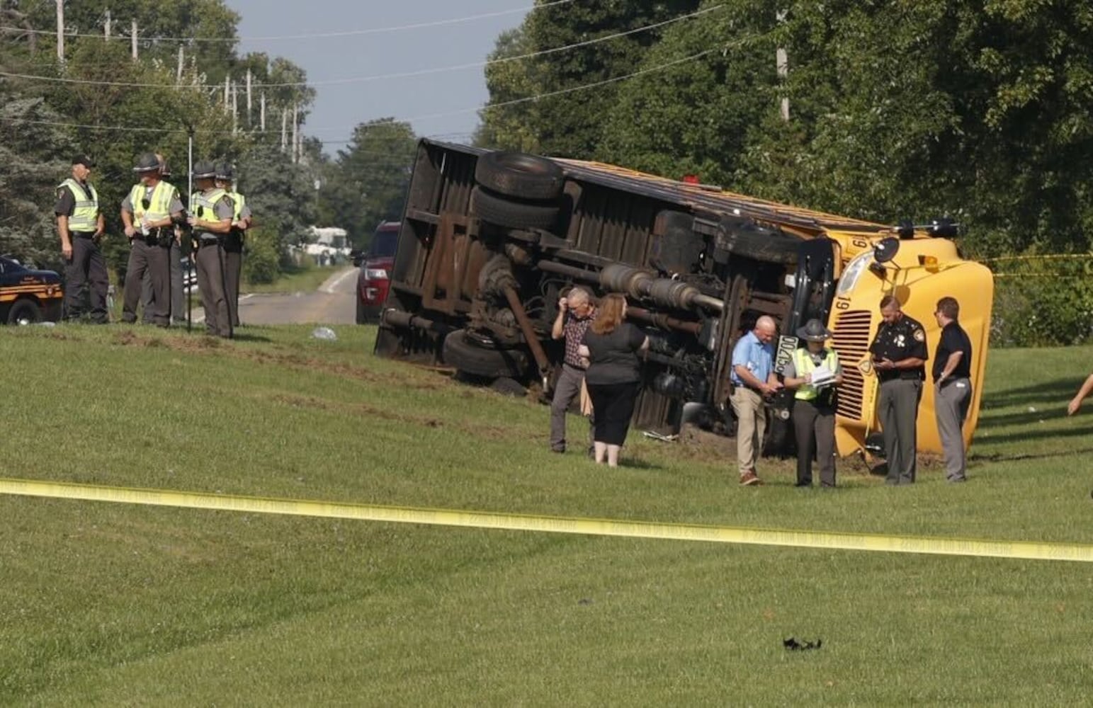 One killed after Northwestern school bus overturns in crash