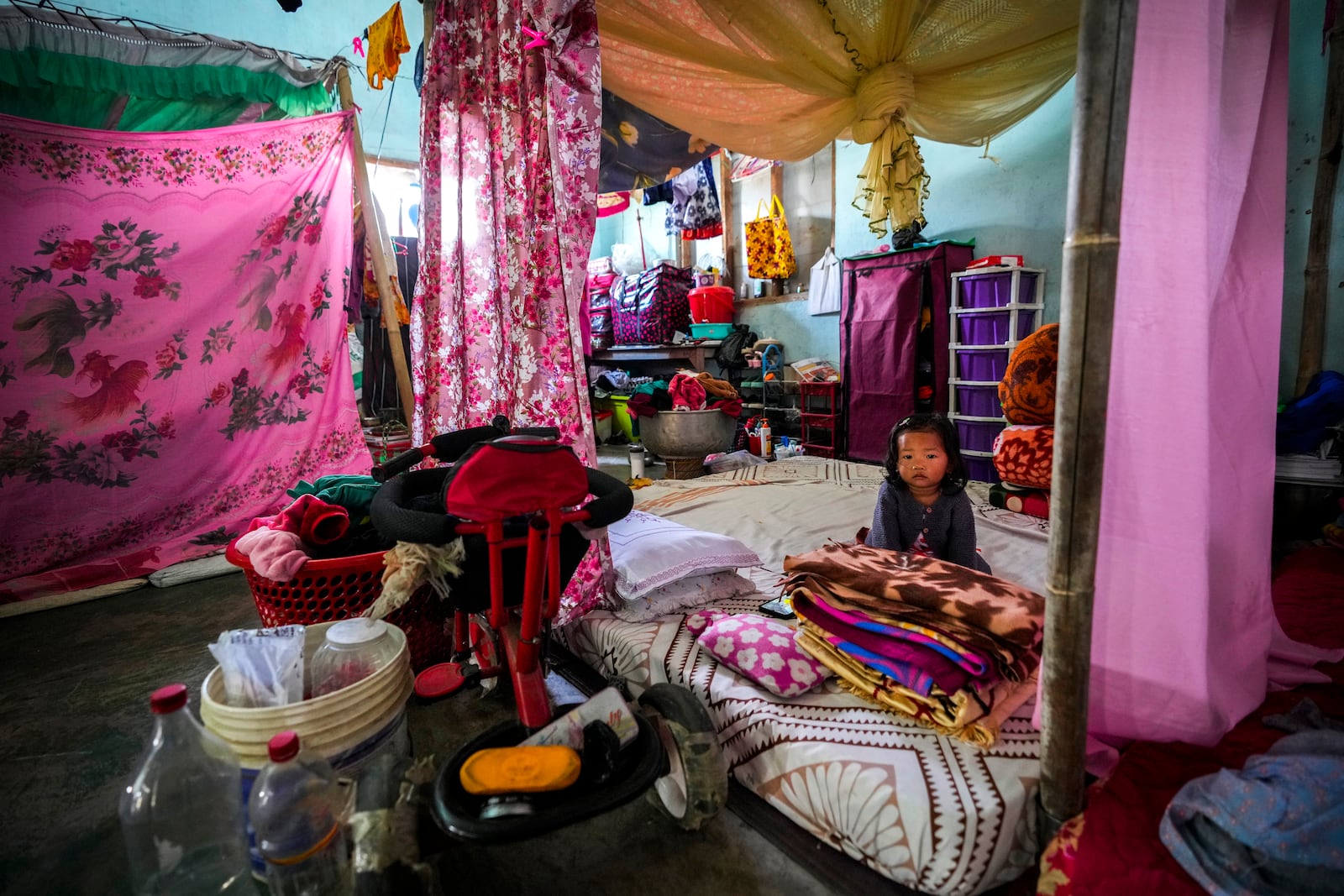 A Meitei girl sits in a relief camp in Imphal, Manipur, Monday, Dec. 16, 2024. (AP Photo/Anupam Nath)