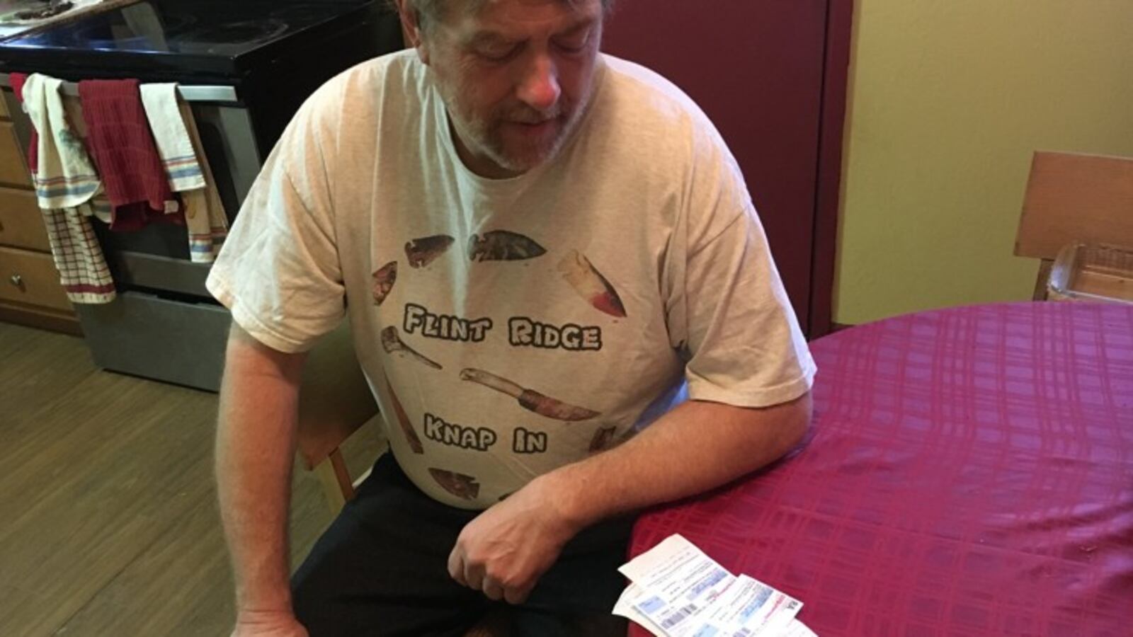 Tim Rau of Kettering looks over pharmacy receipts for insulin. He and other diabetics have been angered by rising insulin prices and a lack of transparency over the reasons. KATIE WEDELL/STAFF