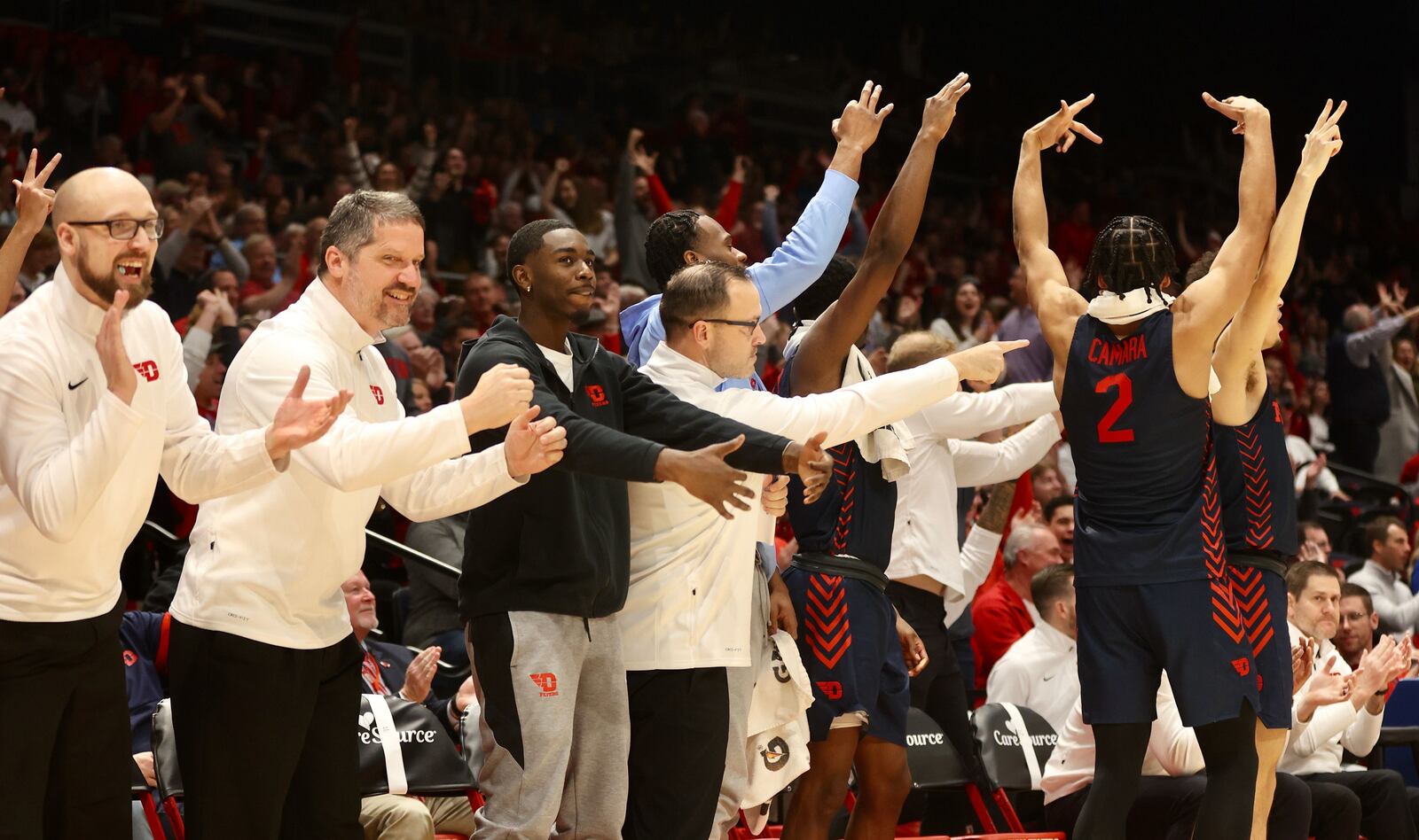 The Dayton bench reacts to a basket during a game against Alcorn State on Tuesday, Dec. 20, 2022, at UD Arena. David Jablonski/Staff